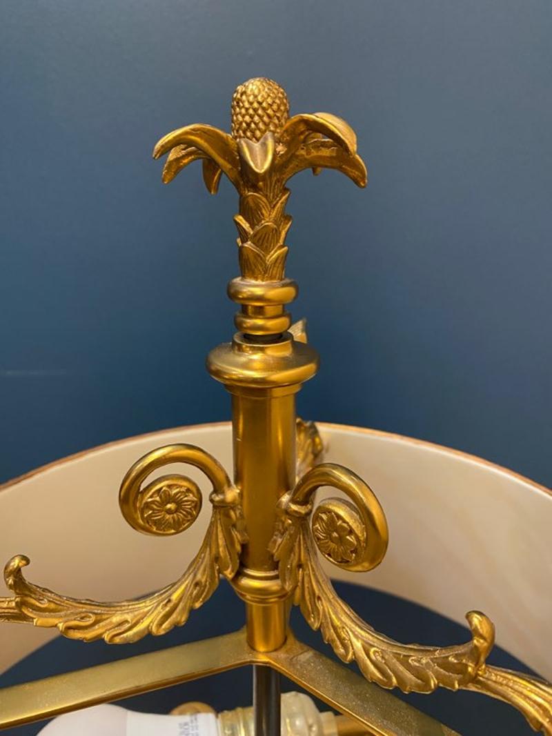 20th Century Empire Style Bouillette lamp with painted tole shade
Adjustable painted tole shade over three faux lights above winged maidens, raised on a column above an acanthus decorated dish
United States, 20th Century
Measures: 31.5