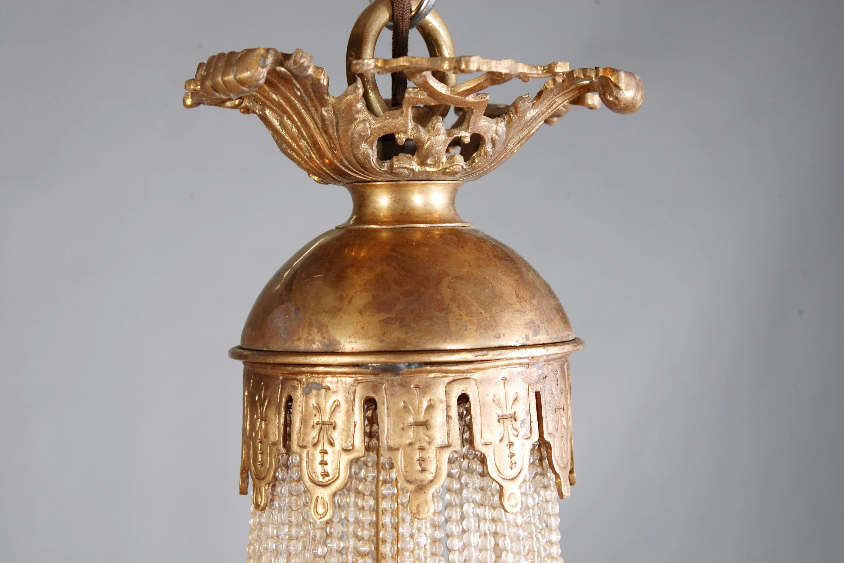 Majestic splendid chandelier in Empire style referred to Empress Joséphine. Exceptionally cine, engraved and cast bronze. Basket-formed corpus from handcut Frenches ball prisms . Connected through wide, mythological ornamental reliefed and broken