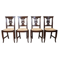 20th Century Empire Style Set of Four Walnut Chairs with Straw Seat