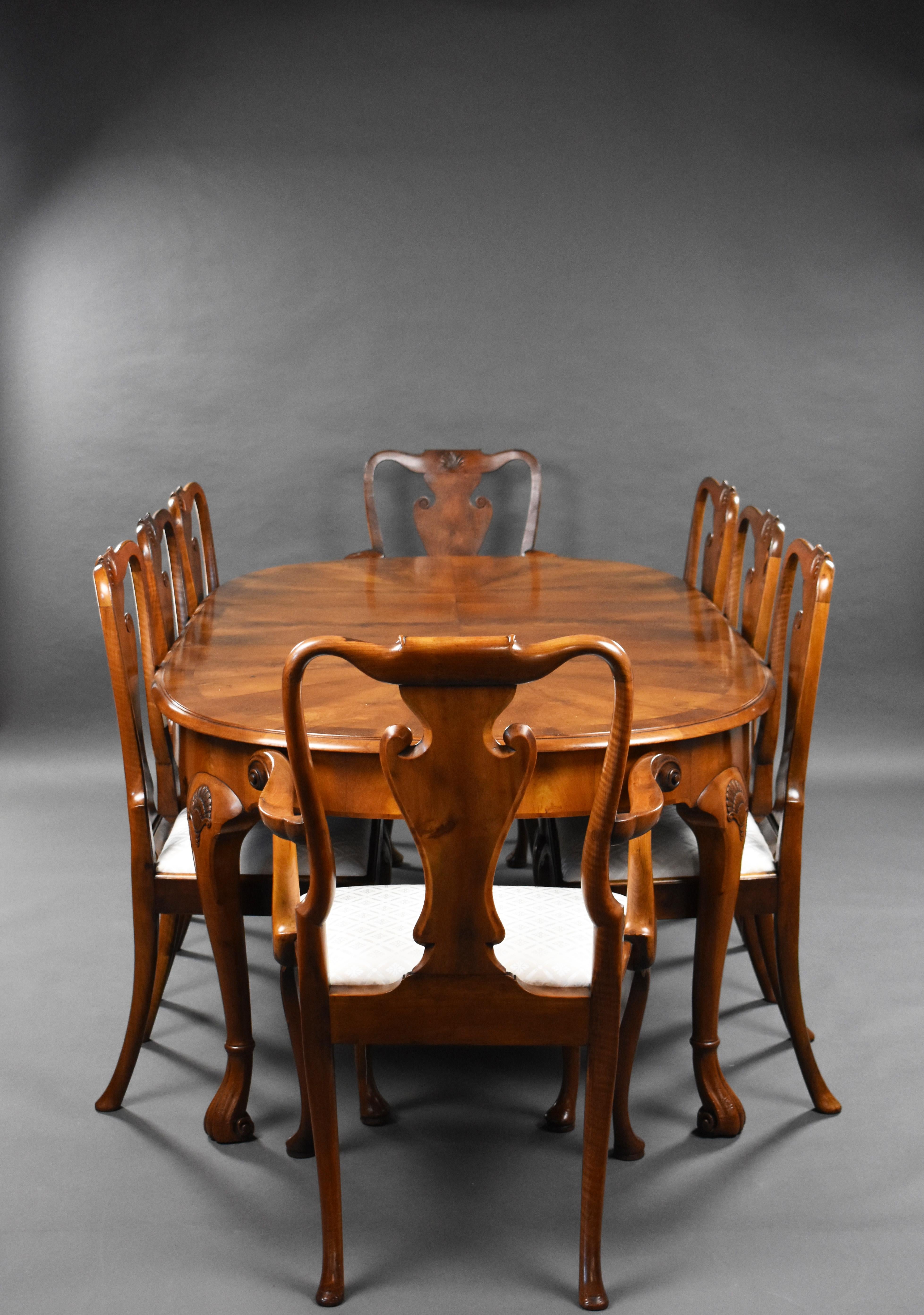 For sale is a good quality walnut extending dining table & chairs. The set of chairs, in the Queen Anne Style, have vase shaped backs, standing on cabriole legs. The table has a well figured top and an additional leaf, standing on cabriole legs with