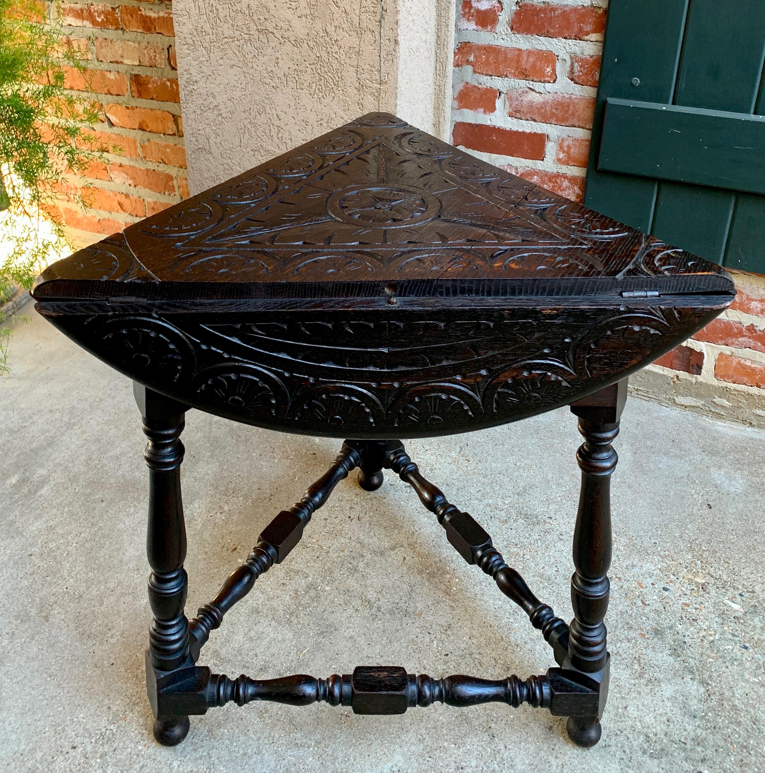 Jacobean 20th Century English Carved Dark Oak Envelope Handkerchief Drop-Leaf Table Round