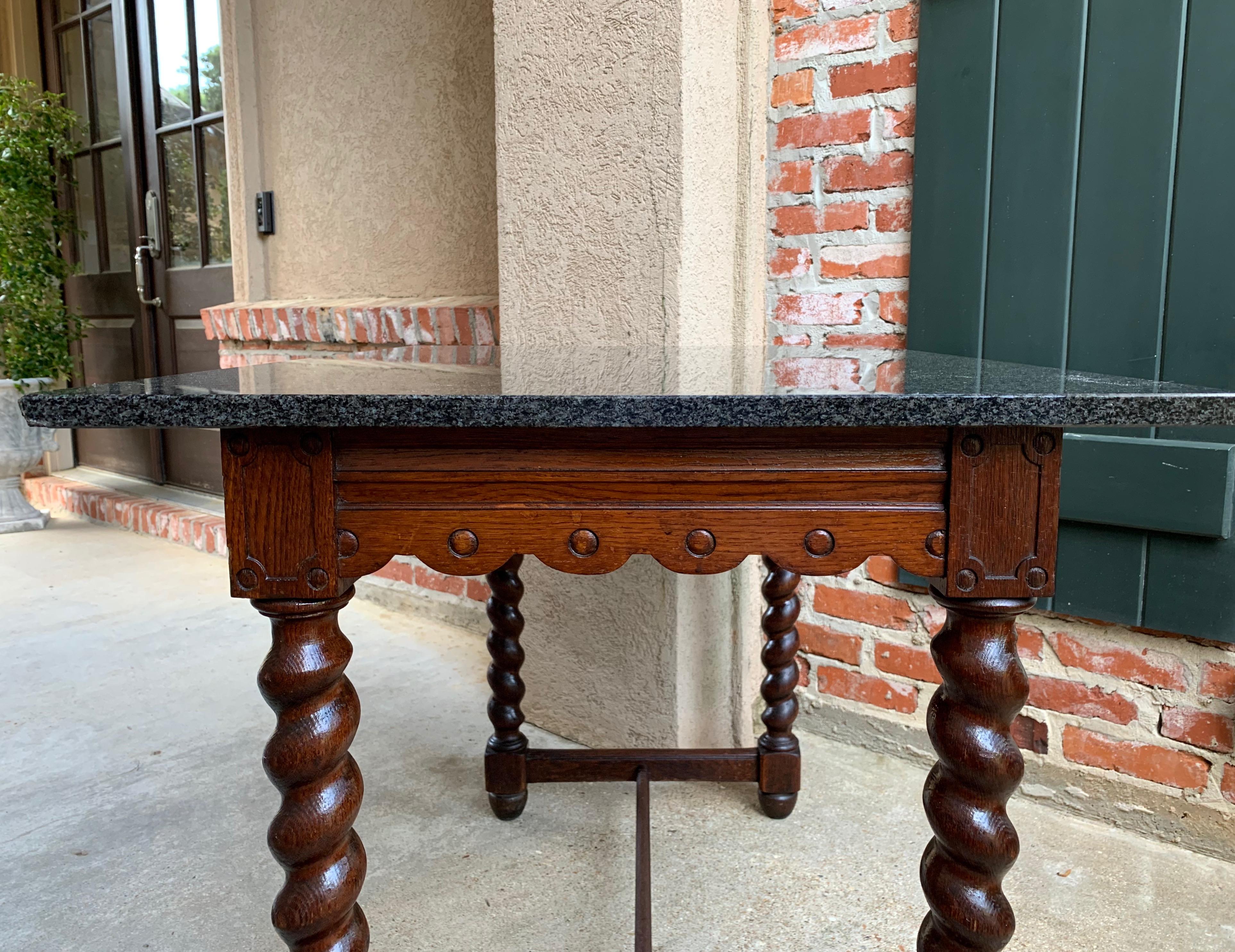 Direct from England, a large antique English oak hall or side table!~
~Oak base features British barley twist legs on all sides, and
a lovely scalloped edge apron~
~Grooves on the scalloped apron with button trim on all sides and the