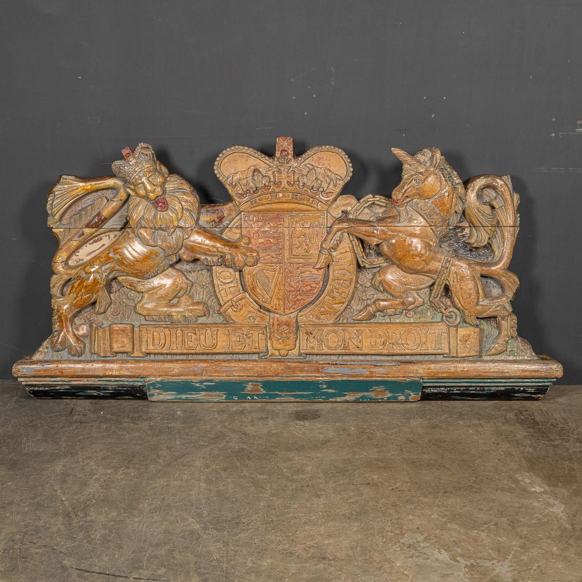 Antique early 20th Century large and impressive English Armorial Coat of Arms beautifully carved in two pieces. This crest has been gently restored and retains its natural patina created by age. An incredible piece of history and a very decorative