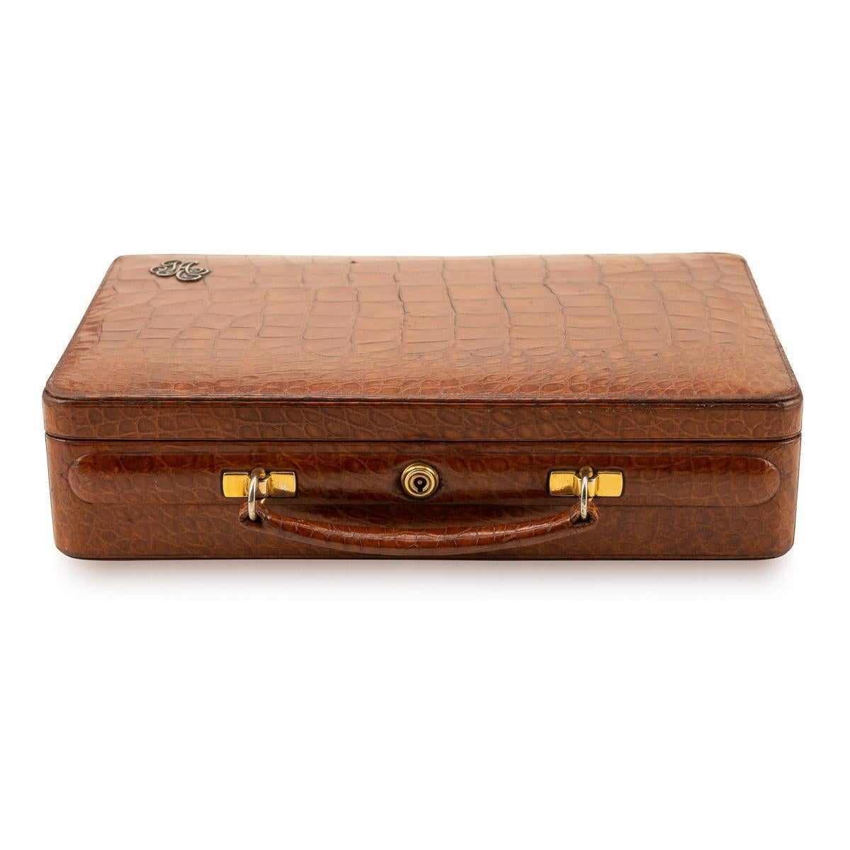 Antique early-20th century English crocodile jewellery case, with two concertina trays lined in light velvet with the initials JA in silver on the outside of the case, set with a Bramah lock and key. Retailed by renowned L.C Vickery or Regent st,