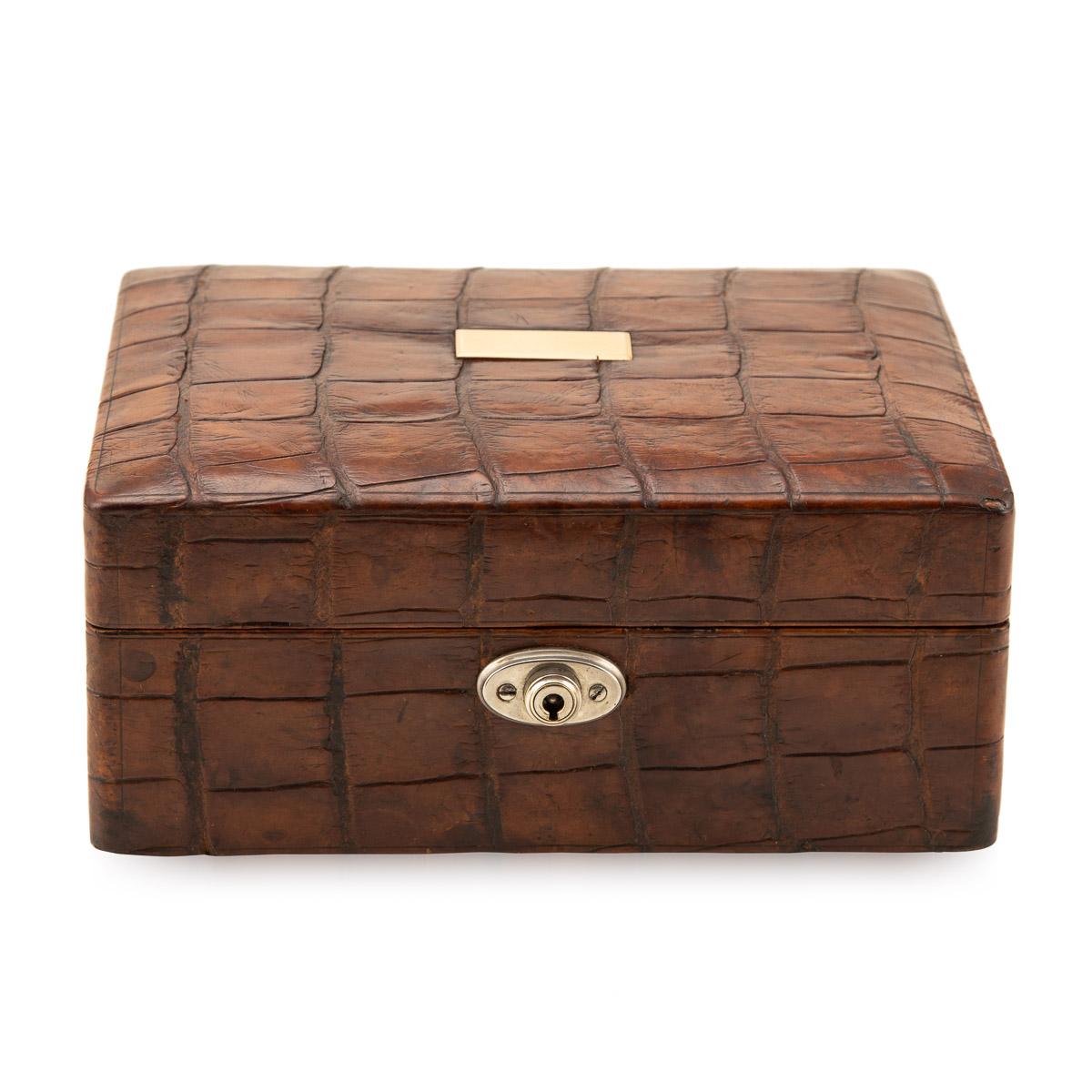 Antique early-20th century crocodile jewellery case, with original lock and key and a small brass plaque for initials on top. The case is oozing style and elegance, this makes for a fantastic conversation piece, a very practical item suitable for