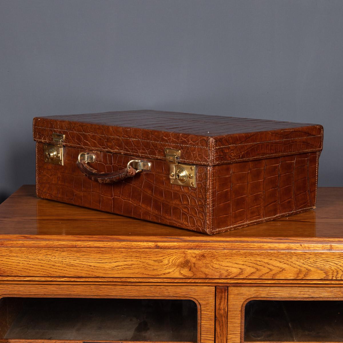 Antique early-20th century crocodile overnight travel case, made by Drew & Sons, by Royal Appointment to the Queen. The case is oozing style and elegance, this case makes for a fantastic conversation piece, a very practical item suitable for any