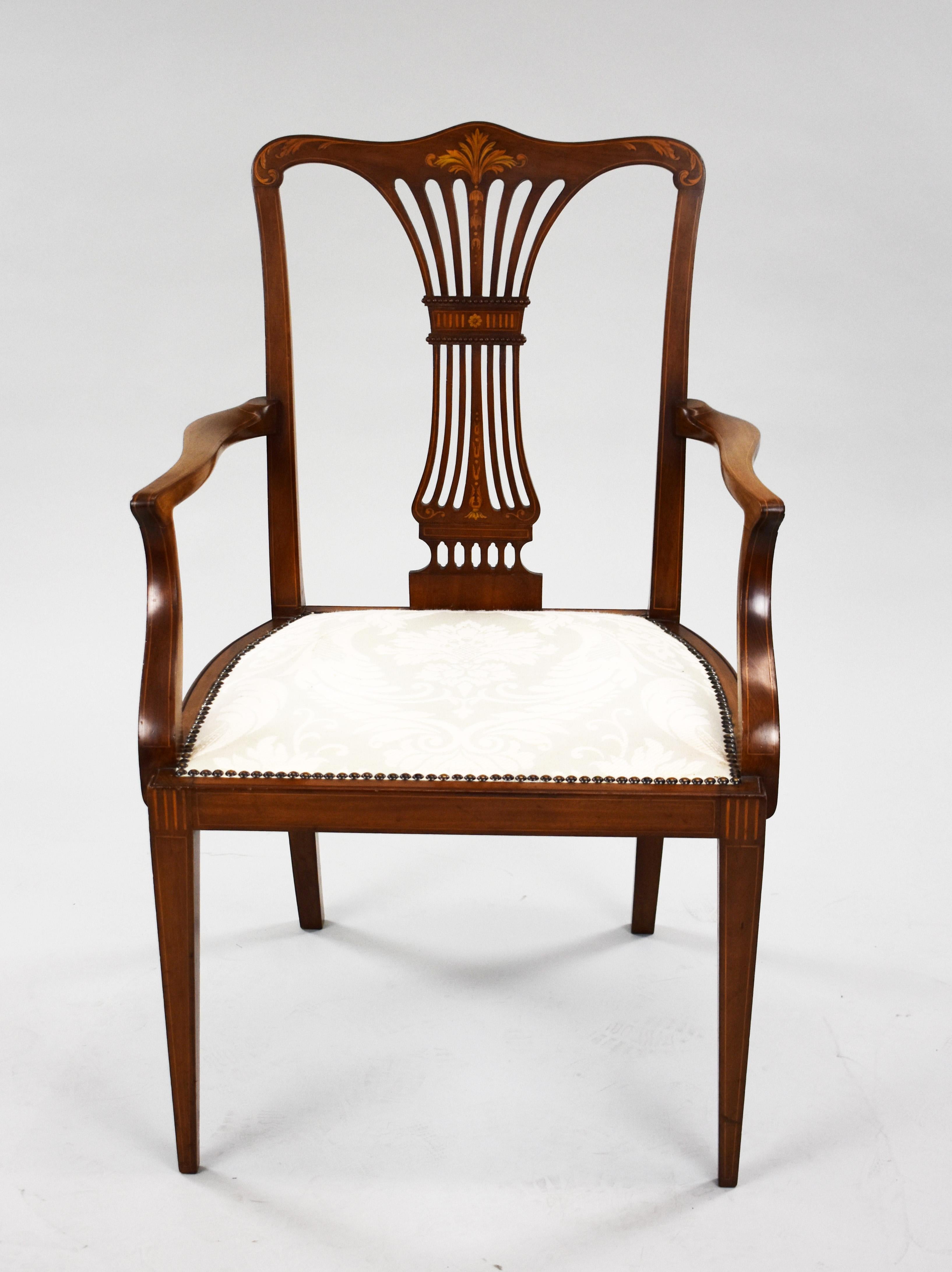 For sale is a good quality Edwardian mahogany inlaid open armchair, remaining in very good condition for its age. 

Measures: Width: 58cm Depth: 55cm Height: 91cm.