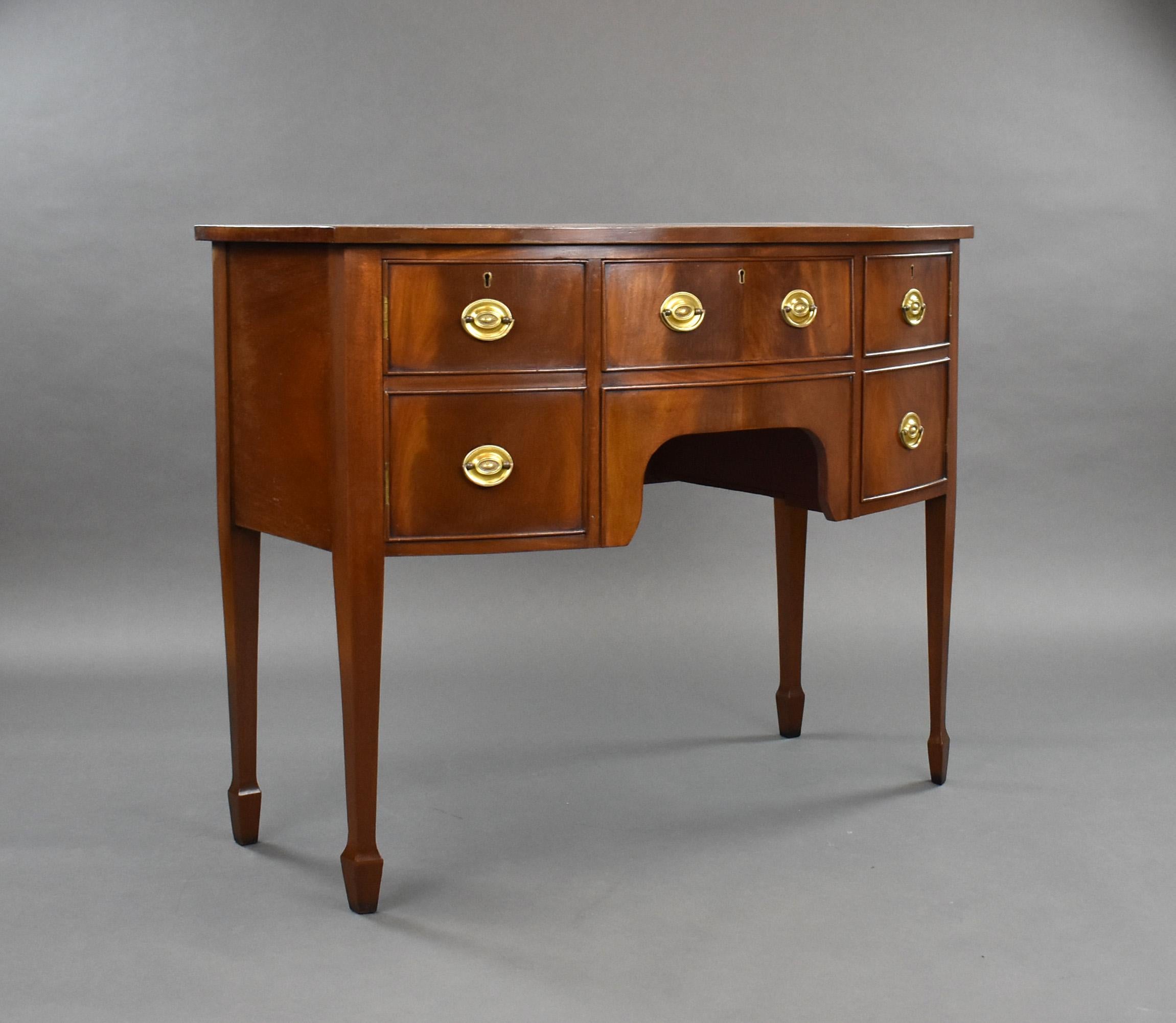 For sale is an Edwardian mahogany bow front sideboard, having a drawer to the centre with a cupboard on either side. Standing on tapered legs terminating on spade feet, the sideboard remains in very good condition for its age. 

Measures: width: