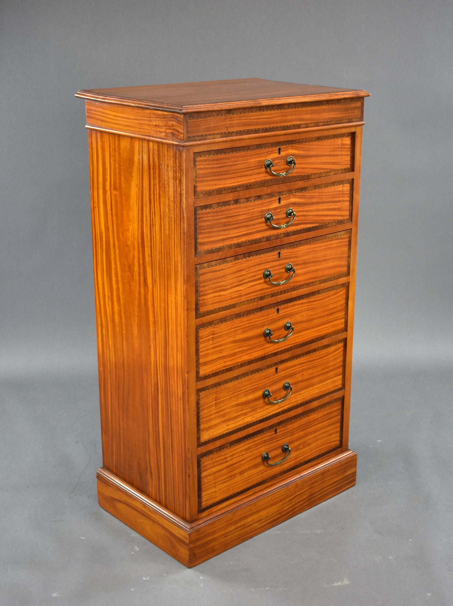 A good quality Edwardian satinwood and inlaid chest of drawers. The top of the chest is inlaid to the edge, above six graduated drawers, each having oak lined drawers and brass handles. This piece is in excellent condition having been completely