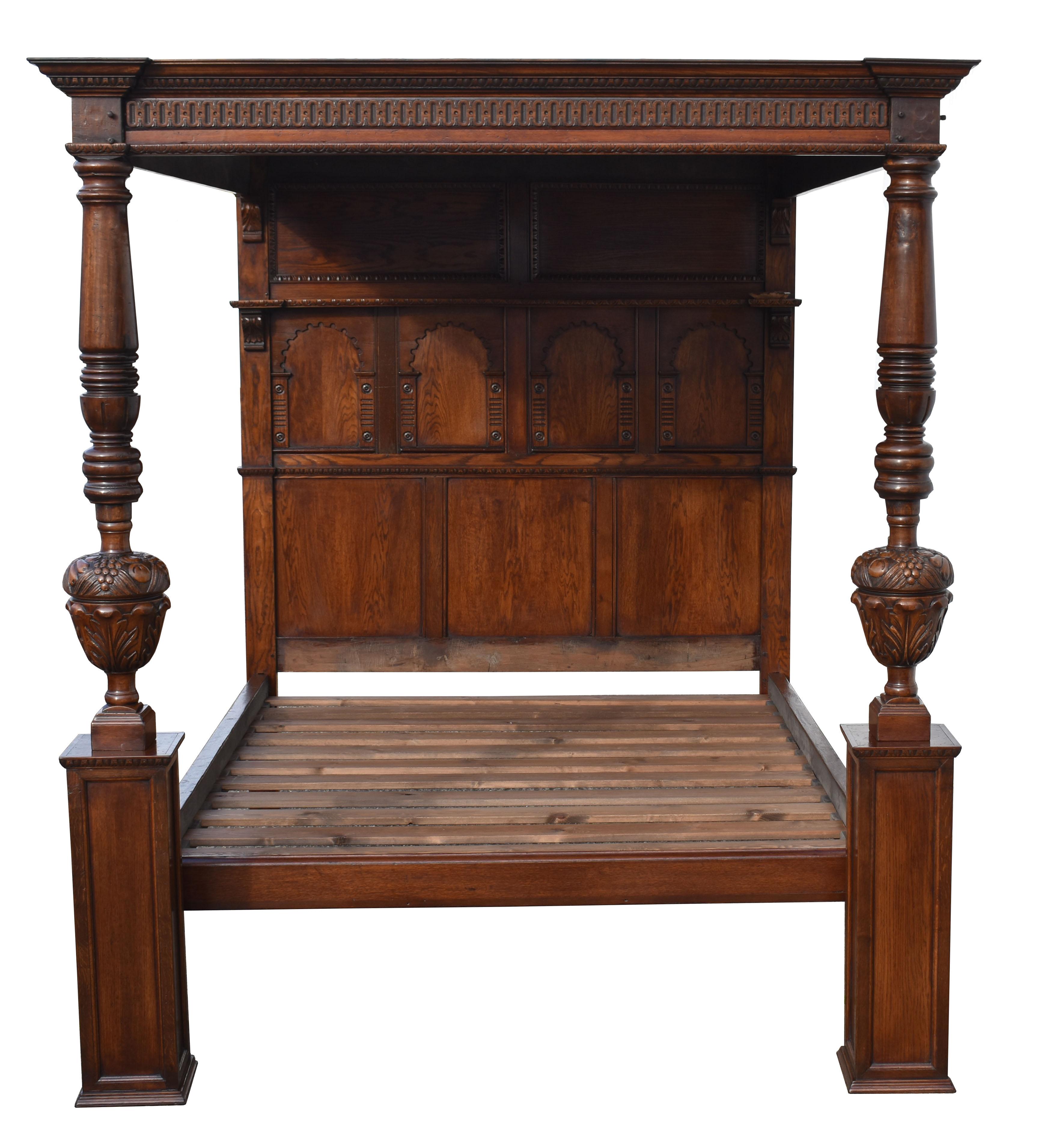 For sale is an Elizabethan style carved oak four poster bed. Having a carved and moulded cornice enclosing a paneled canopy. The headboard has four arched panels with panels above and below. The canopy is supported by two turned and carved columns
