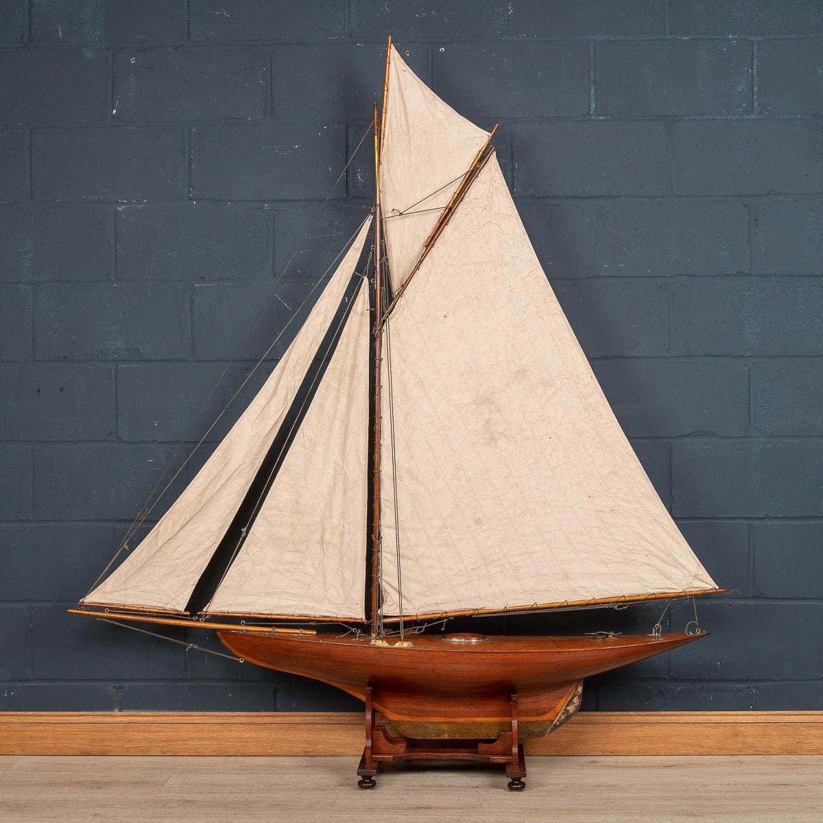 A massive antique gaff rigged cutter pond yacht, lovely mahogany plank on frame hull dating to the first half of the 20th century. The yacht is an example of British pond racing yacht and would have raced against similar yachts in competitions, club