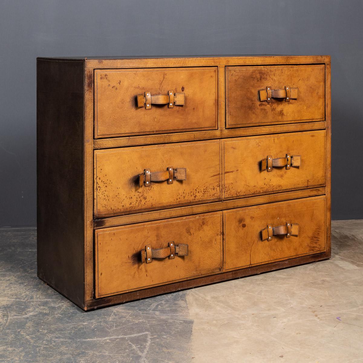 Stunning 20th century English leather covered (in tan hide) 2 over 3 chest of drawers with original leather luggage handles. This chest is oozing style and elegance, this case makes for a fantastic conversation piece, a very practical item suitable