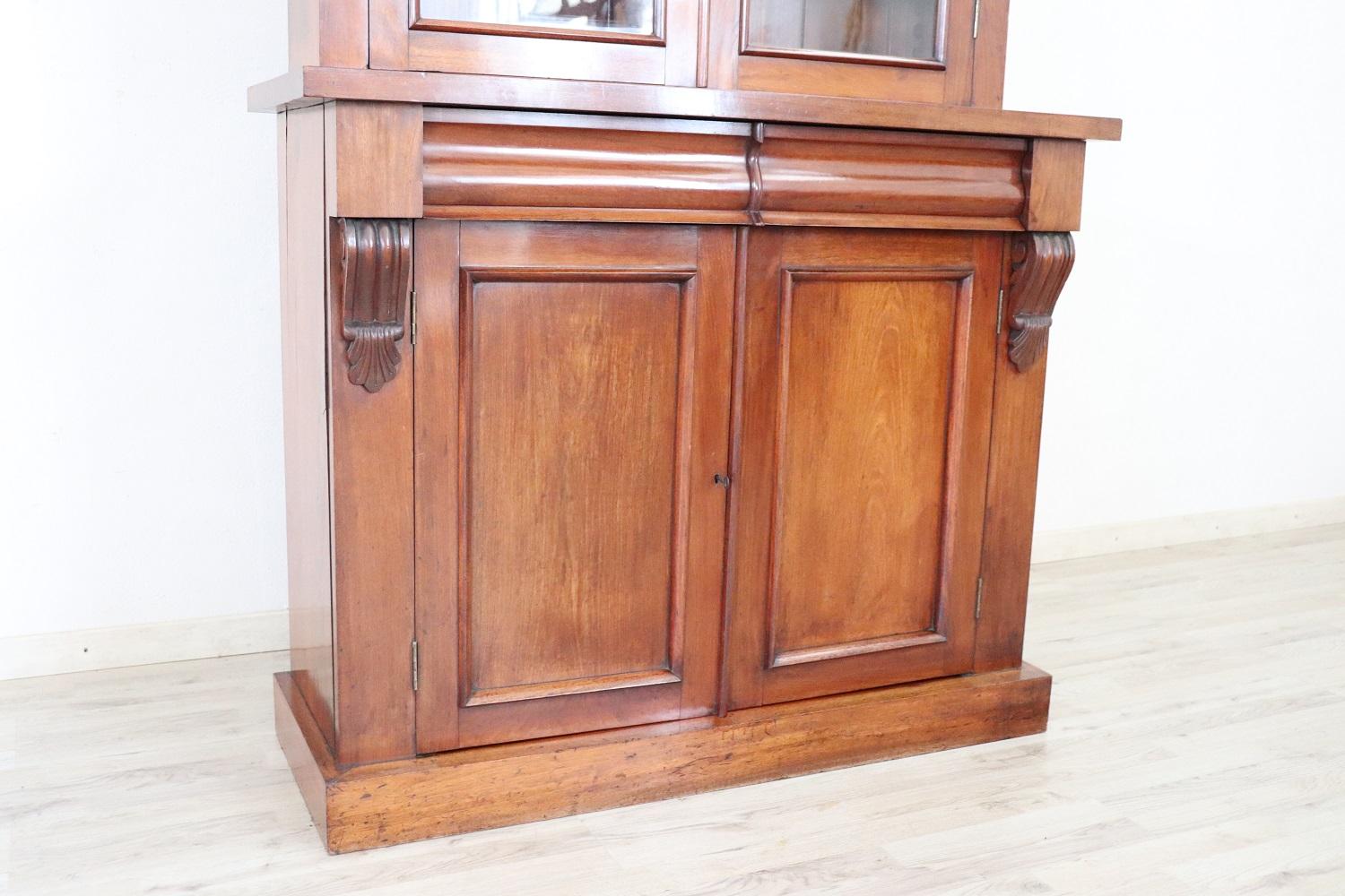 Elegant cabinet in precious mahogany 1950s. The upper part is with glasses to display your precious objects or books. Equipped with two practical drawers. Truly elegant and important for any room in the house. Perfect condition ready to be placed in
