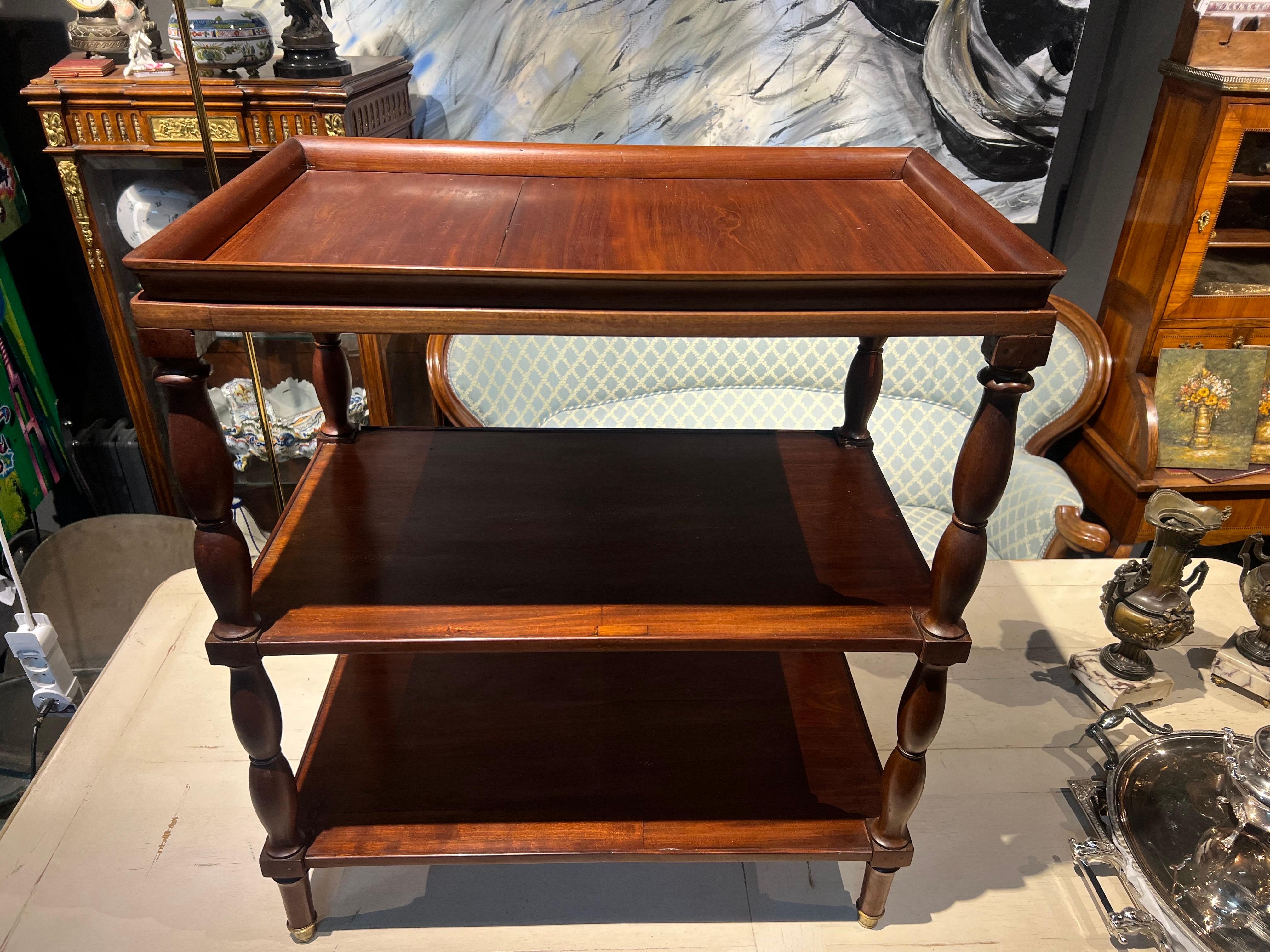 20th Century English mahogany hand carved serving or side table on three levels having bamboo shaped legs raised on elegant brass boots. Very good authentic condition with no restorations made.
England, circa 1920 