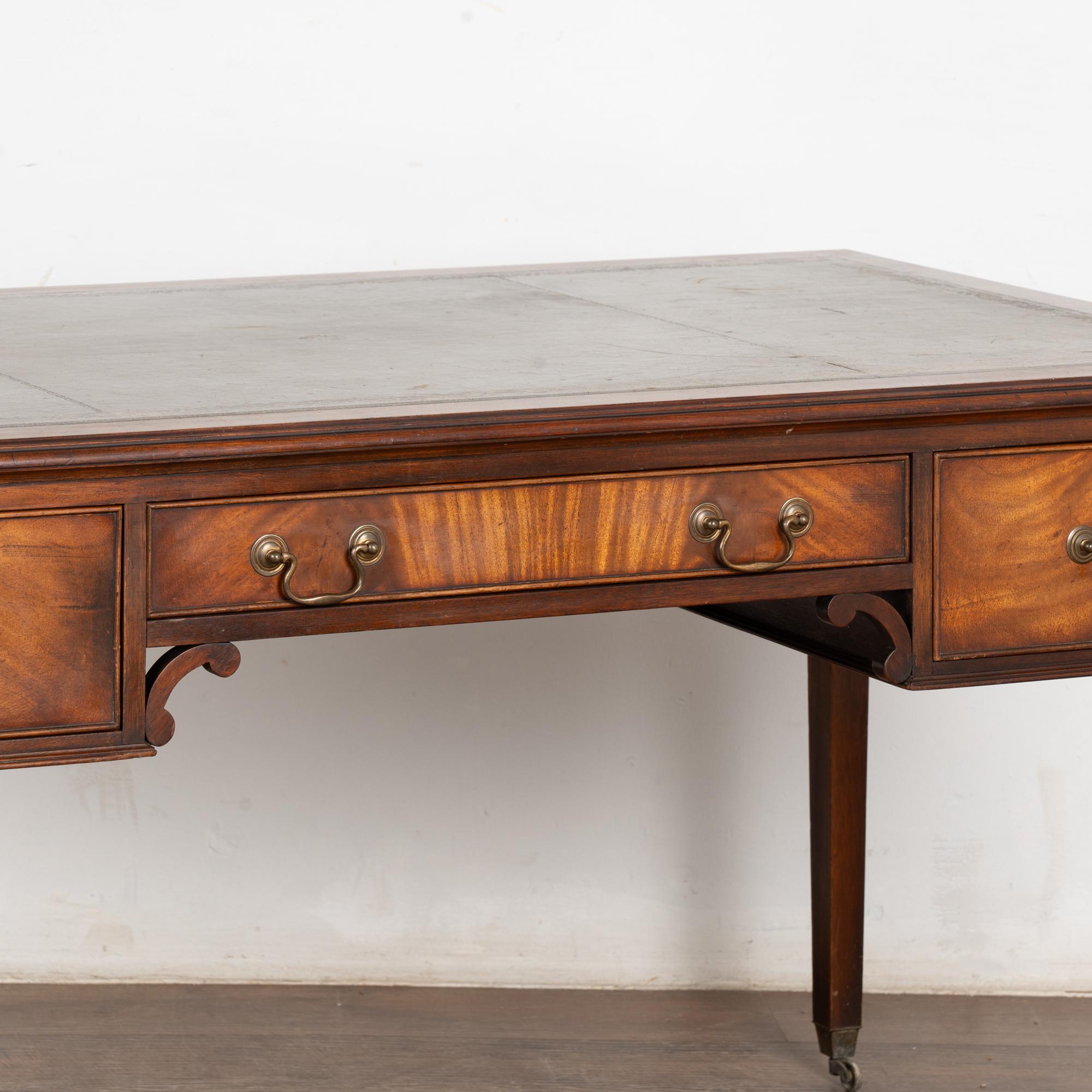 20th Century English Mahogany Writing Desk With Three Drawers Green Leather Top 9