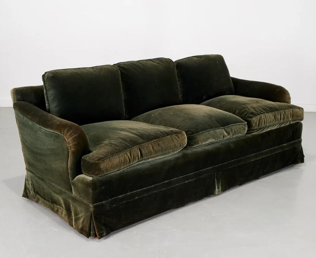 20th century English custom-made 3-seat saddle arm sofa in dark moss green velvet. Wood legs, condition as shown. 