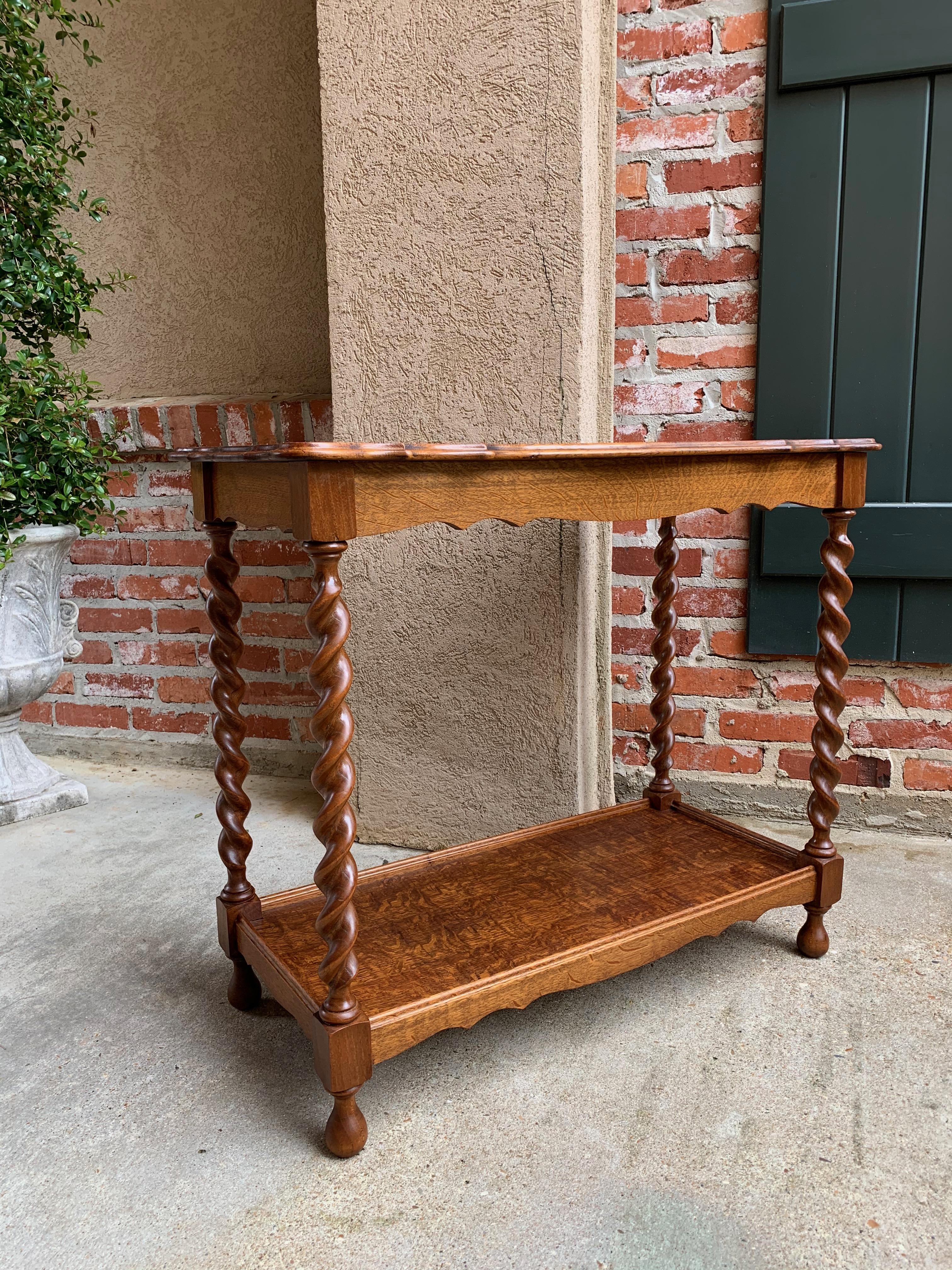 Direct from England, a lovely and versatile antique English tiger oak, barley twist side table!~
~Extra features include a beveled and scalloped upper table edge~
~Lower shelf provides more display and storage area, and in true British style, the