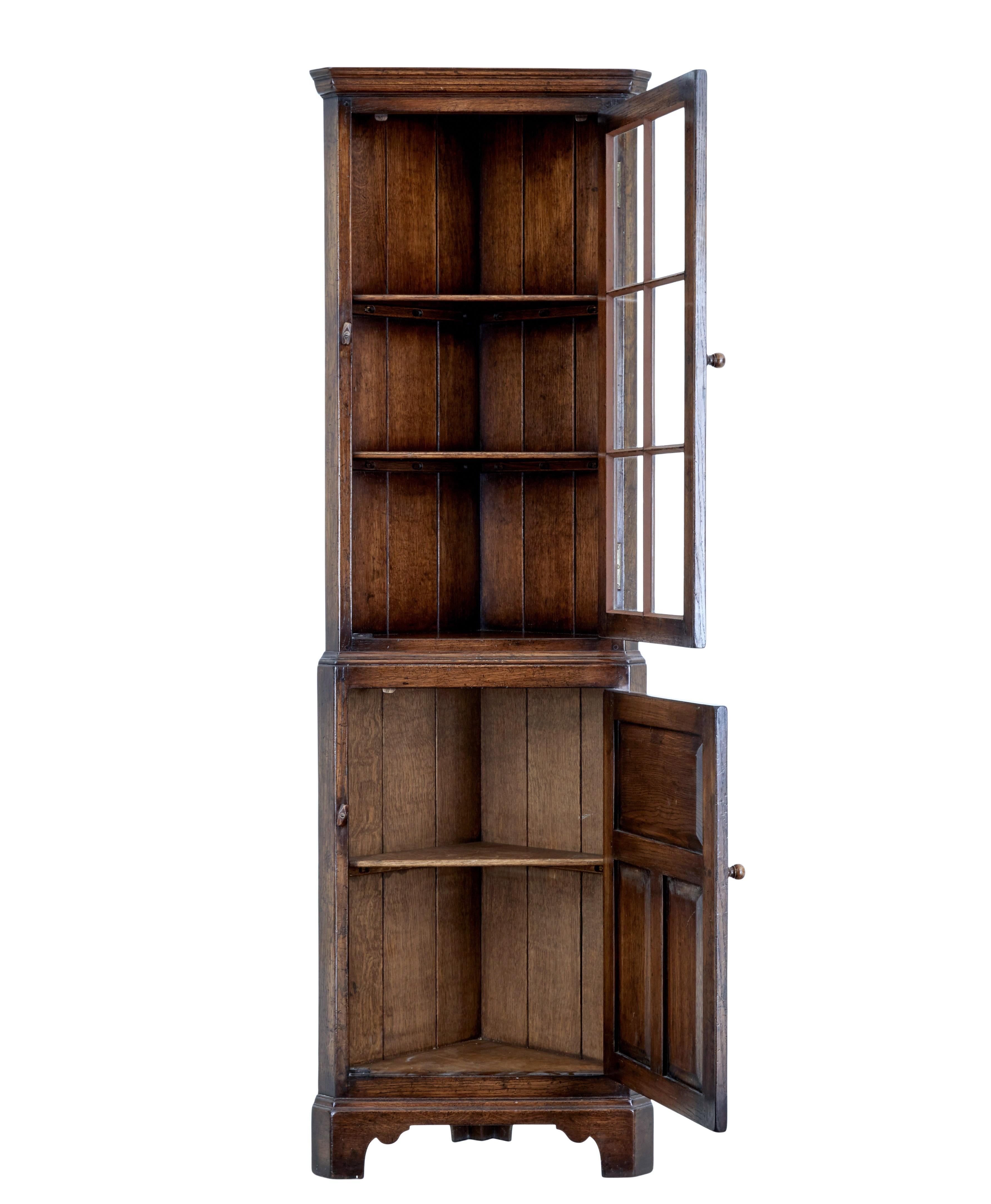20th century english oak corner cabinet circa 1980.

Good quality piece of practical country furniture for the home, which offers the perfect storage solution for corners.

Made in the rustic country style, this 1 piece unit has a single glazed