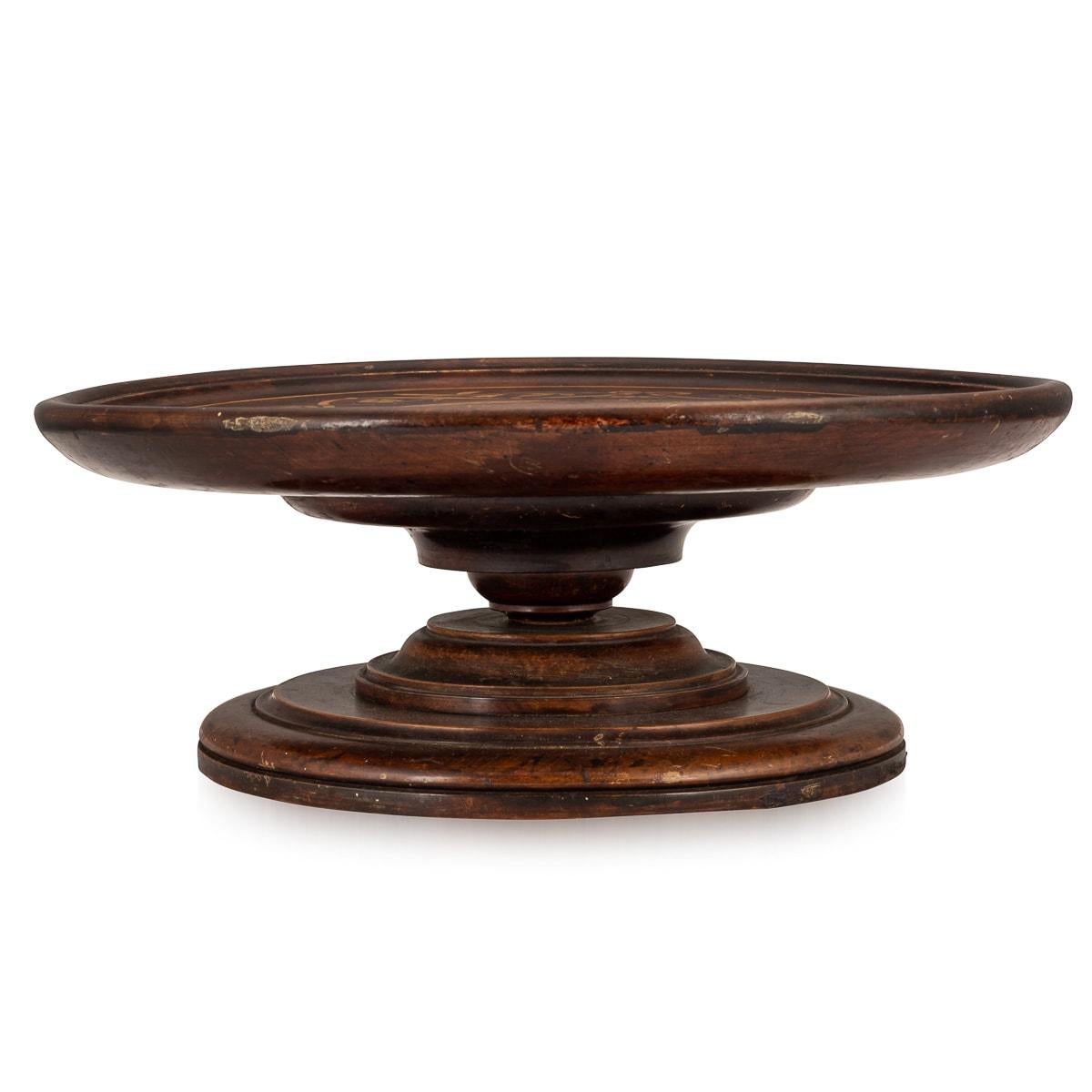 A lovely oak and mahogany inlaid Lazy Susan, made in England around the 1930s. A Lazy Susan is a round tray that rotates and is designed to sit on a countertop or table and allow multiple diners to access food, condiments and relishes without having
