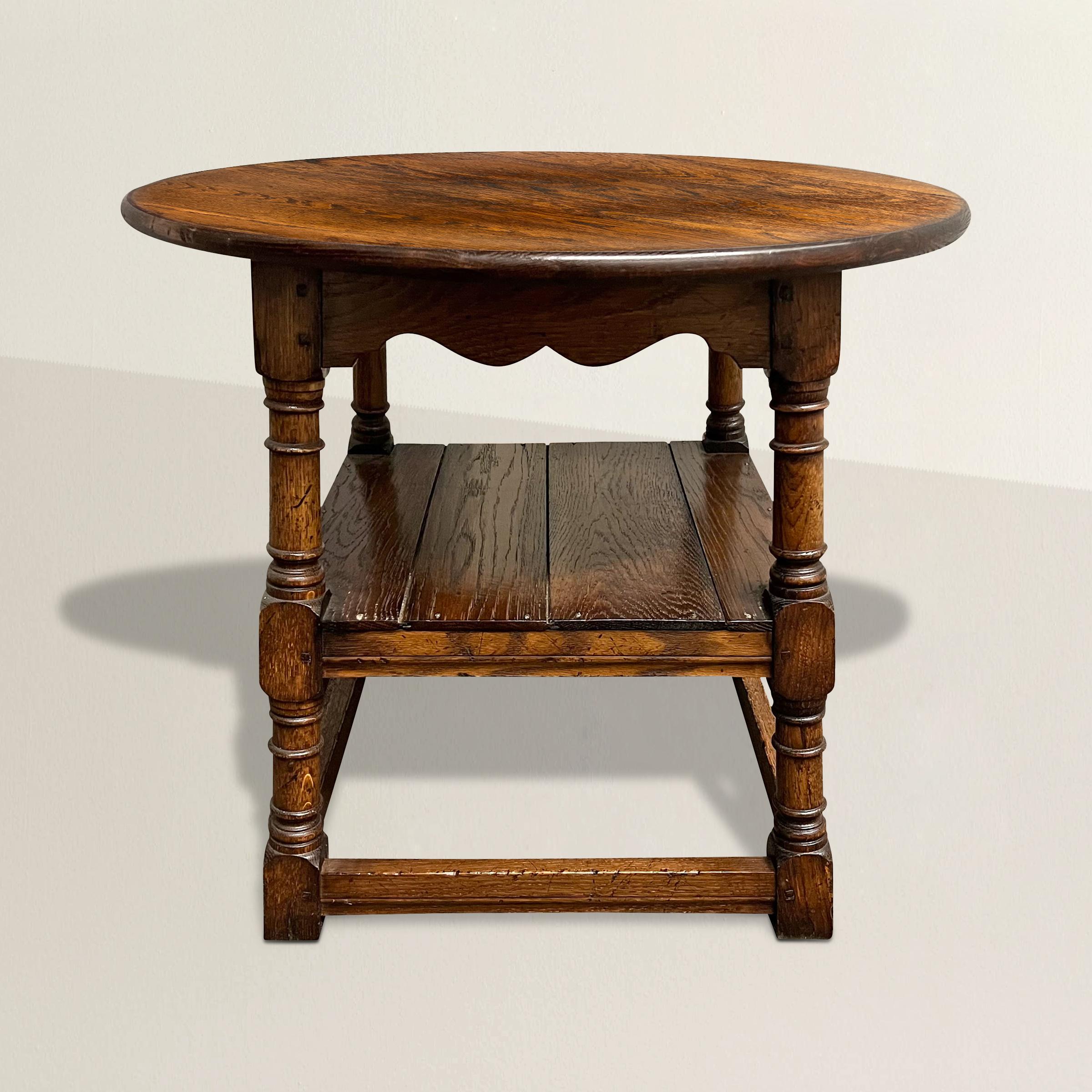 Step into the charm of the English countryside with this delightful 20th century English oak pub table, a versatile gem that combines style and functionality. Crafted with the timeless appeal of oak, this table features elegantly turned legs, a