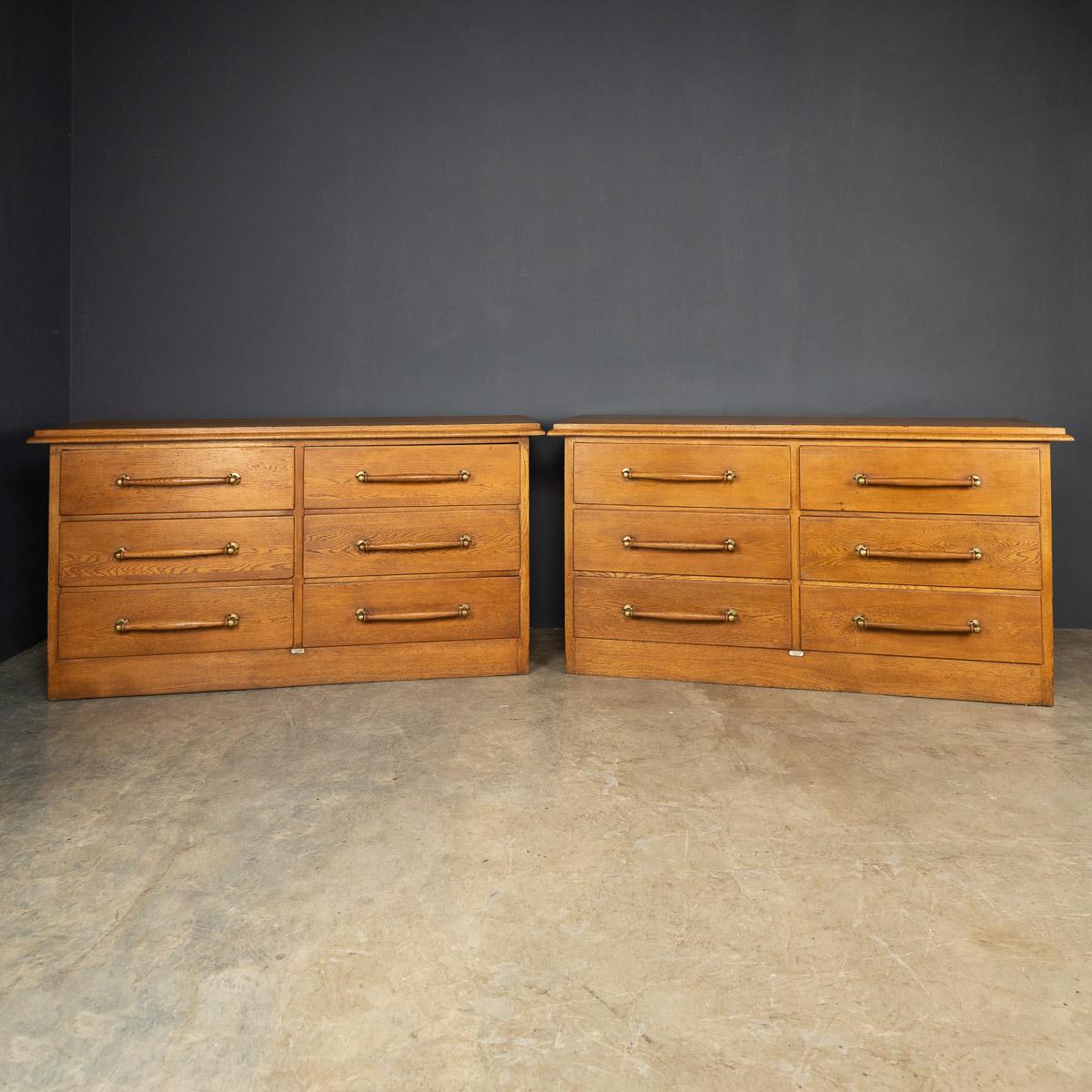 Antique early-20th century English pair of hand crafted mahogany haberdashery, this units would have been undoubtedly used in a prestigious gentleman's clothing store in the fashionable 1900's. Each piece has six retractable drawers with original