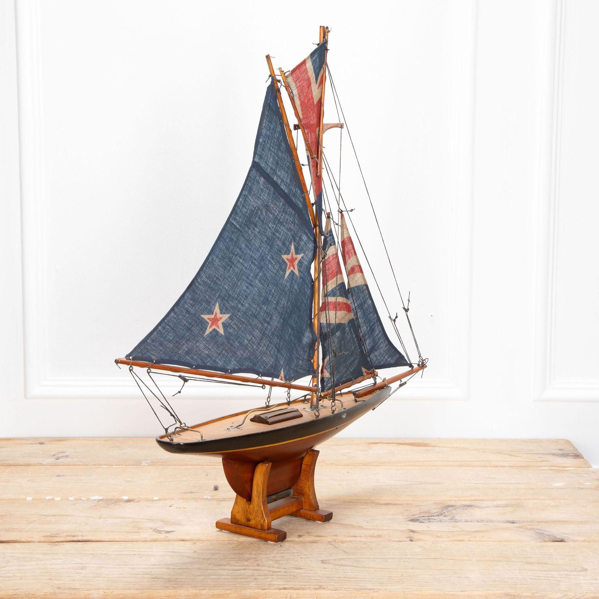 English Pond Yacht re-rigged with original Union Jack flags.
Circa 1930.