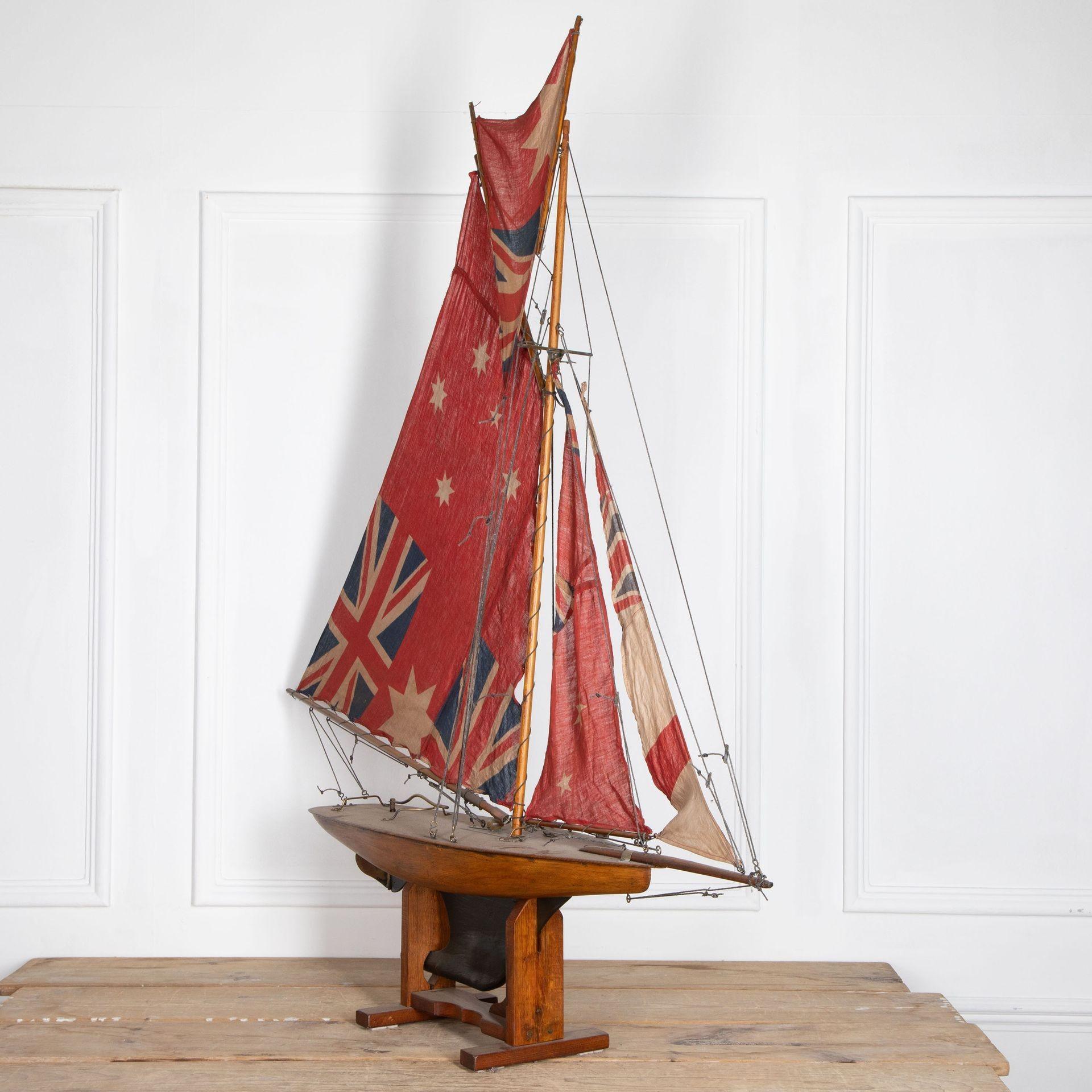 English Pond Yacht re-rigged with original Union Jack flags.
Circa 1930.