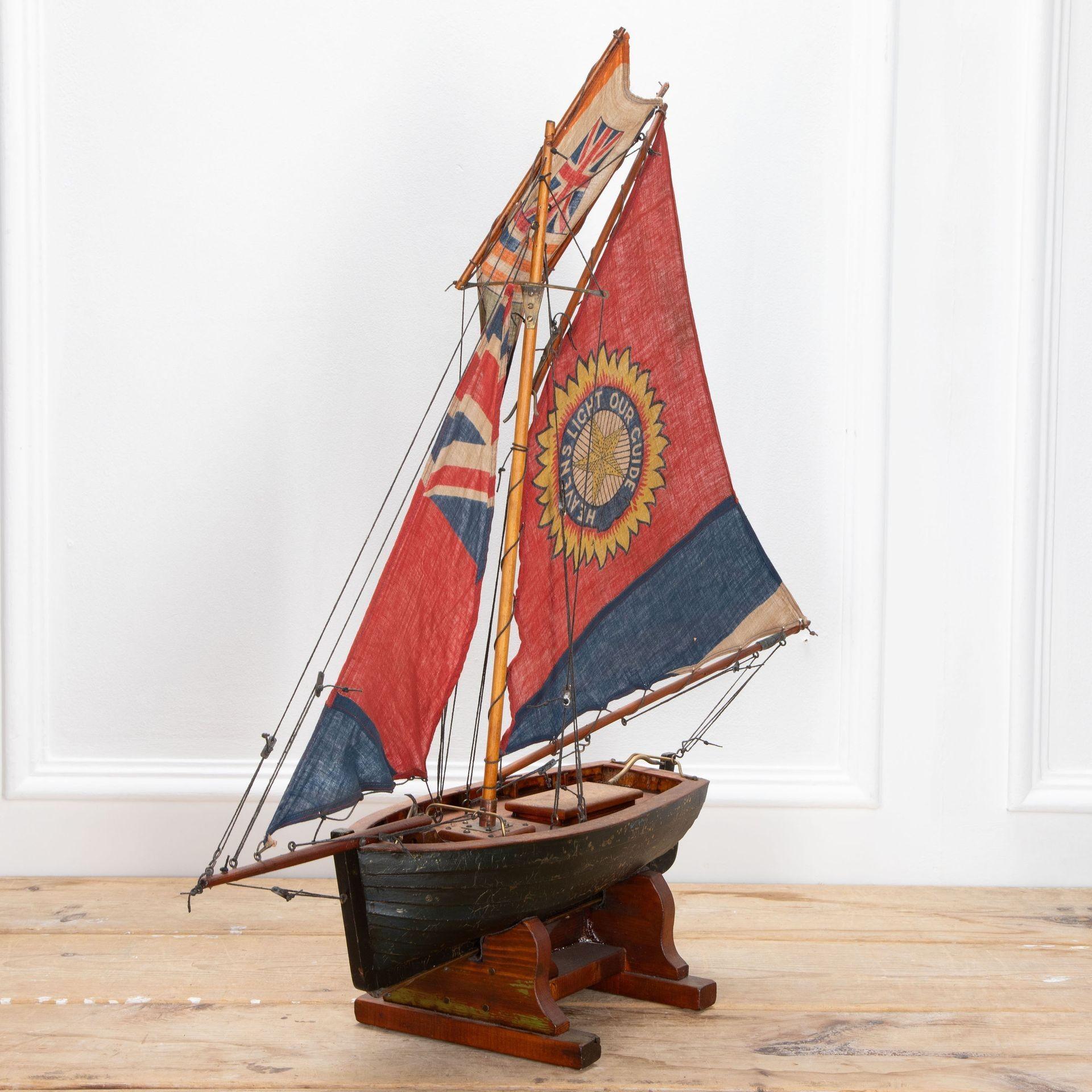 English Pond Yacht re-rigged with original Union Jack flags.
Circa 1930.