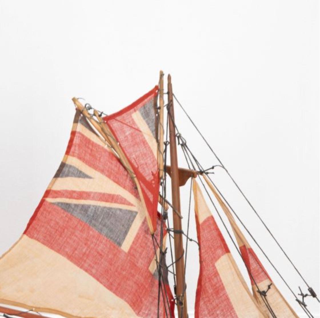 English pond yacht re-rigged with original Union Jack flags
