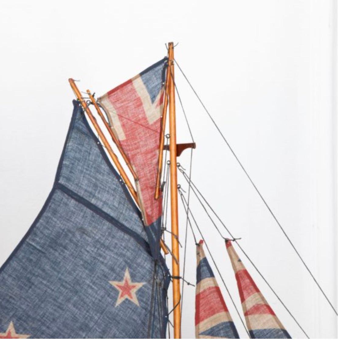 English pond yacht re-rigged with original Union Jack flags