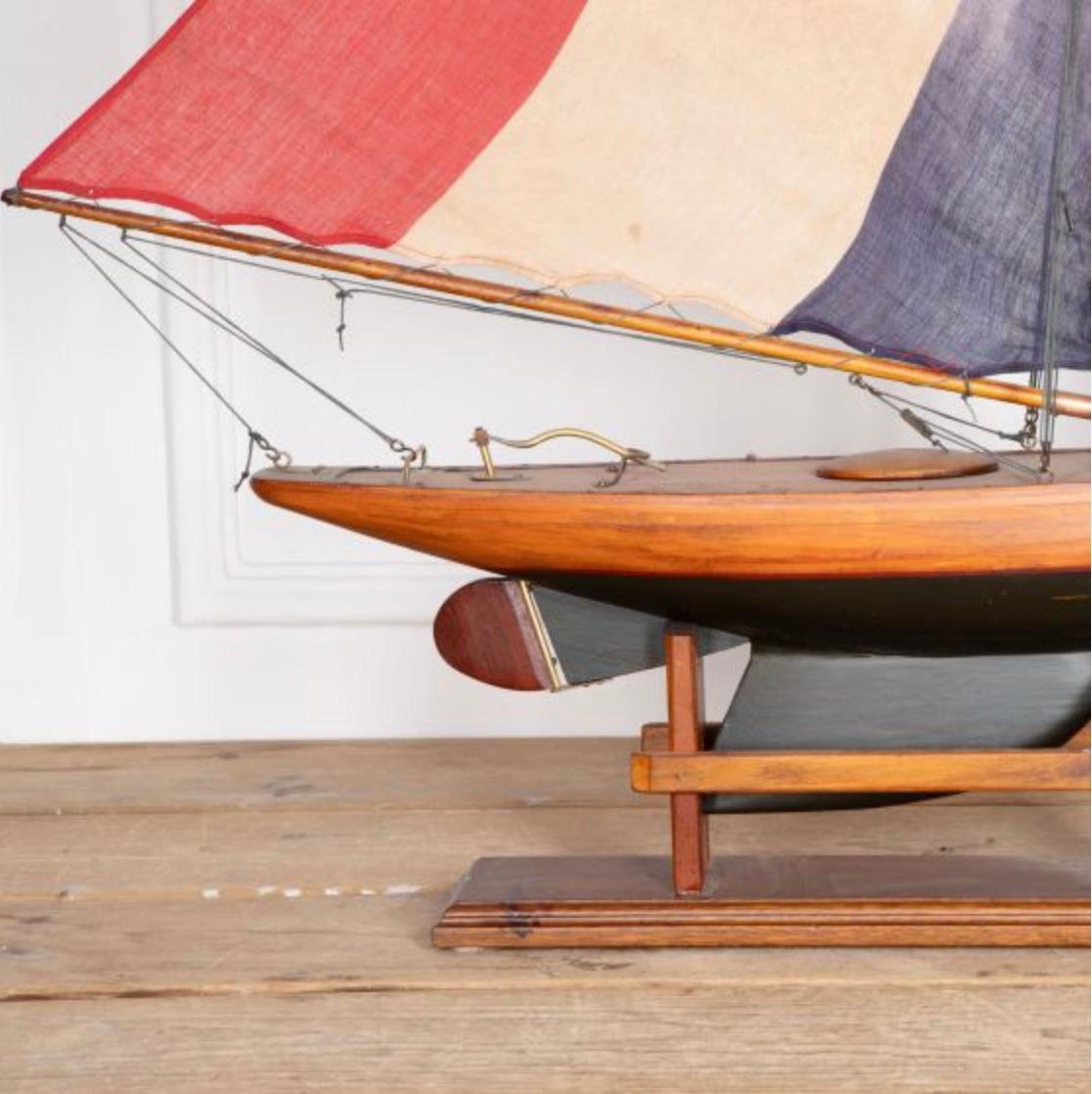 English pond yacht re-rigged with original Union Jack flags