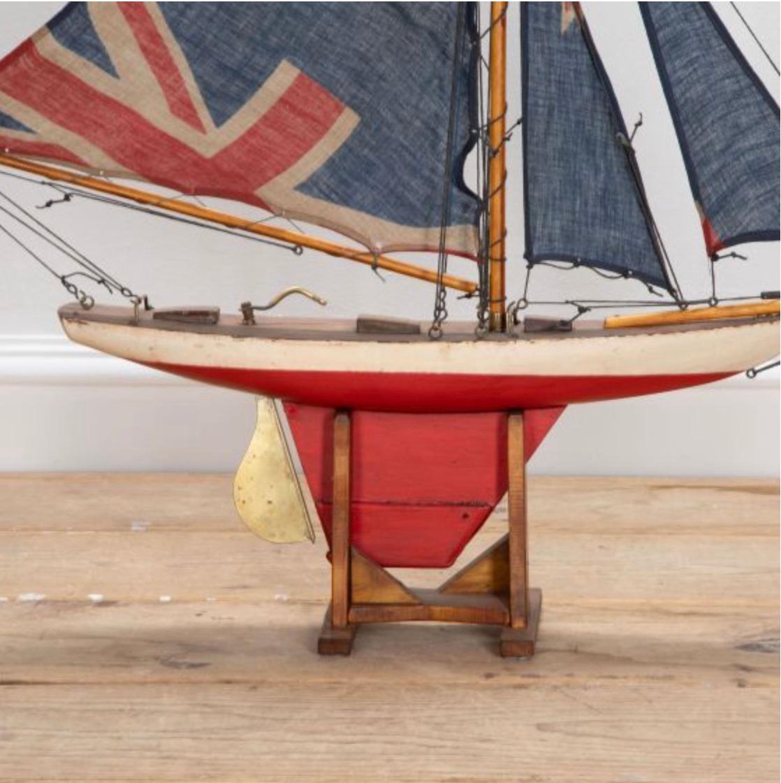 English pond yacht re-rigged with original Union Jack flags