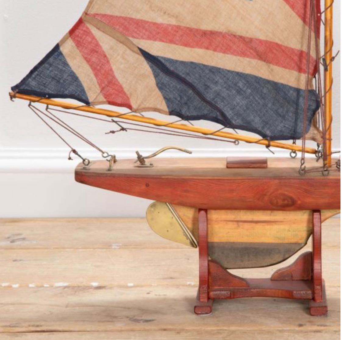 English pond yacht re-rigged with original Union Jack flags