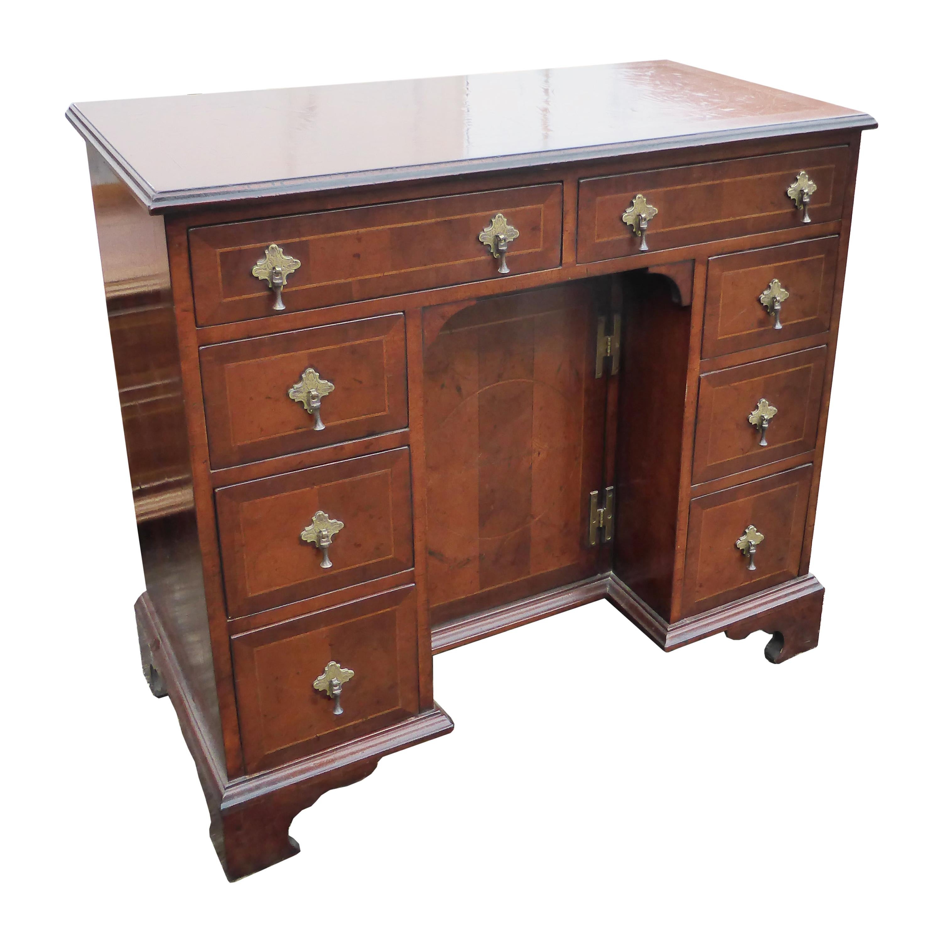 A Portuguese red lacquered and giltwood desk in the Queen Anne taste