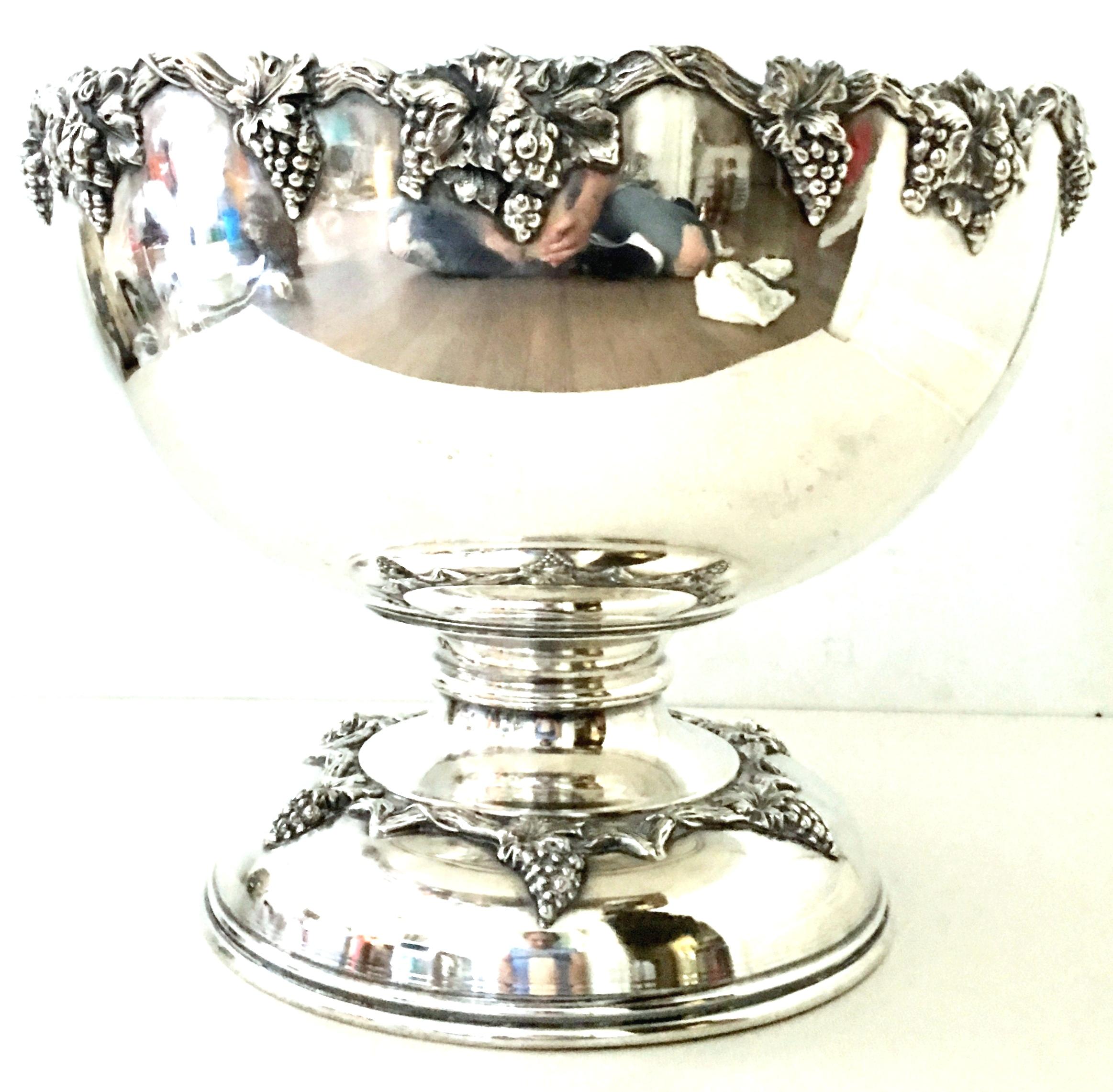 20th Century English Sheffield silver plate footed punch bowl By, Sheffield. Features an organic faux bois berry and vine motif. Signed on the underside with Sheffield England silver plate Hallmarks, Sheffield.