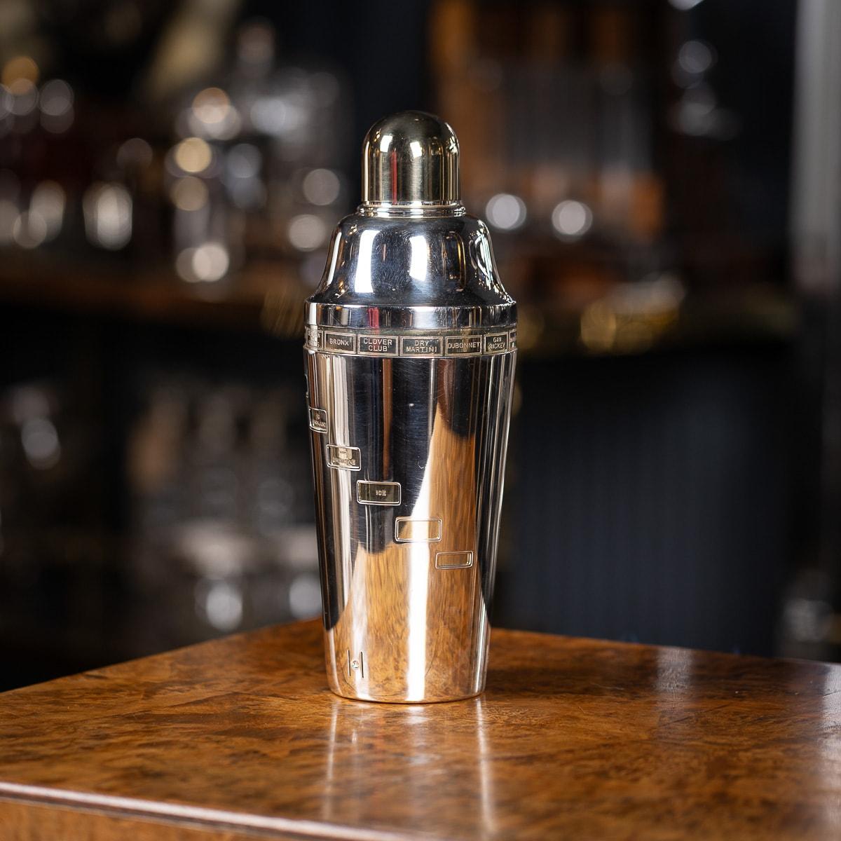 A “dial-a-drink“ recipe cocktail shaker made in the United Kingdom produced in the 1930s by the silversmiths Finnigan's of New Bond St, London. The mechanism works by rotating the shaker, each small adjustment revealing windows which describe how to