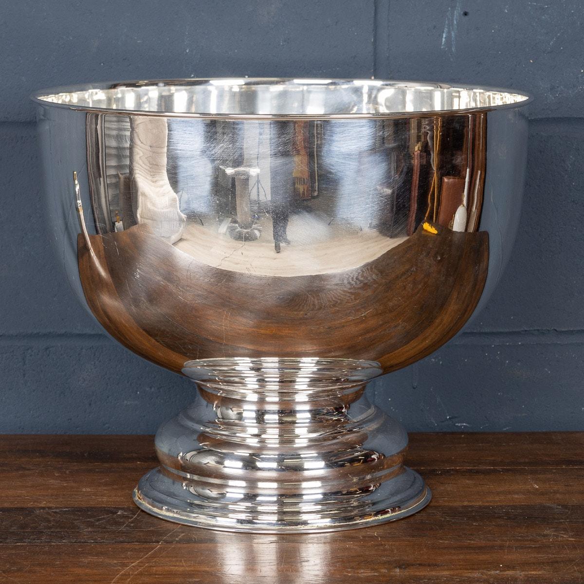 A huge silver plated Rose Bowl made in Sheffield, England by the famous makers James Dixon and Sons. Its majestic dimensions are capable of serving as a massive punchbowl, as a champagne or wine bucket for multiple bottles, or even just as a