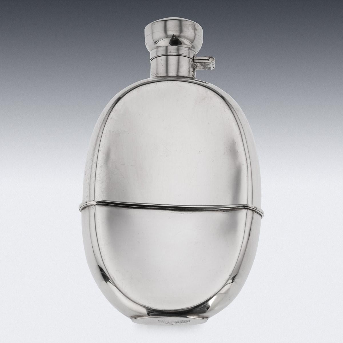 A superb 20th Century solid silver hip flask with silver hinged top. The flask features a smooth surface and a round oval shape along with a detachable cup. Hallmarked sterling silver (925 standard), Sheffield, year 1926 (i), Makers mark Walker &
