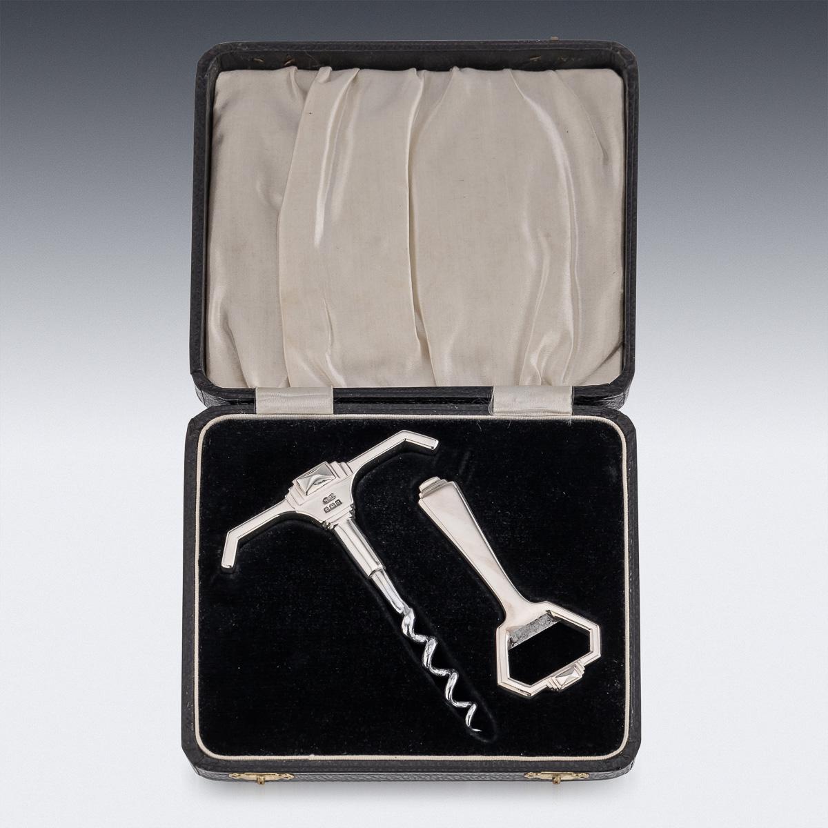Superb mid-20th Century art deco solid silver corkscrew and bottle opener, the corkscrew has a steel helix screw mounted on the solid silver handle piece. The bottle opener is solid silver and in the same angled style. This corkscrew and bottle