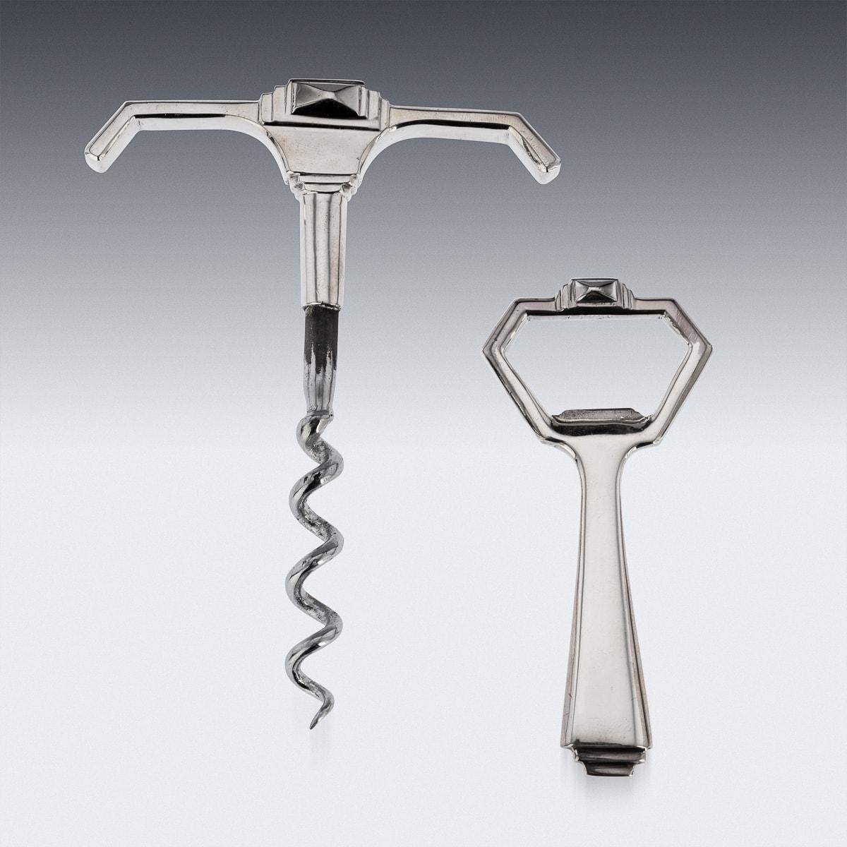 Superb mid-20th Century art deco style solid silver corkscrew and bottle opener, the corkscrew has a steel helix screw mounted on the solid silver handle piece. The bottle opener is solid silver and in the same angled style. This corkscrew and