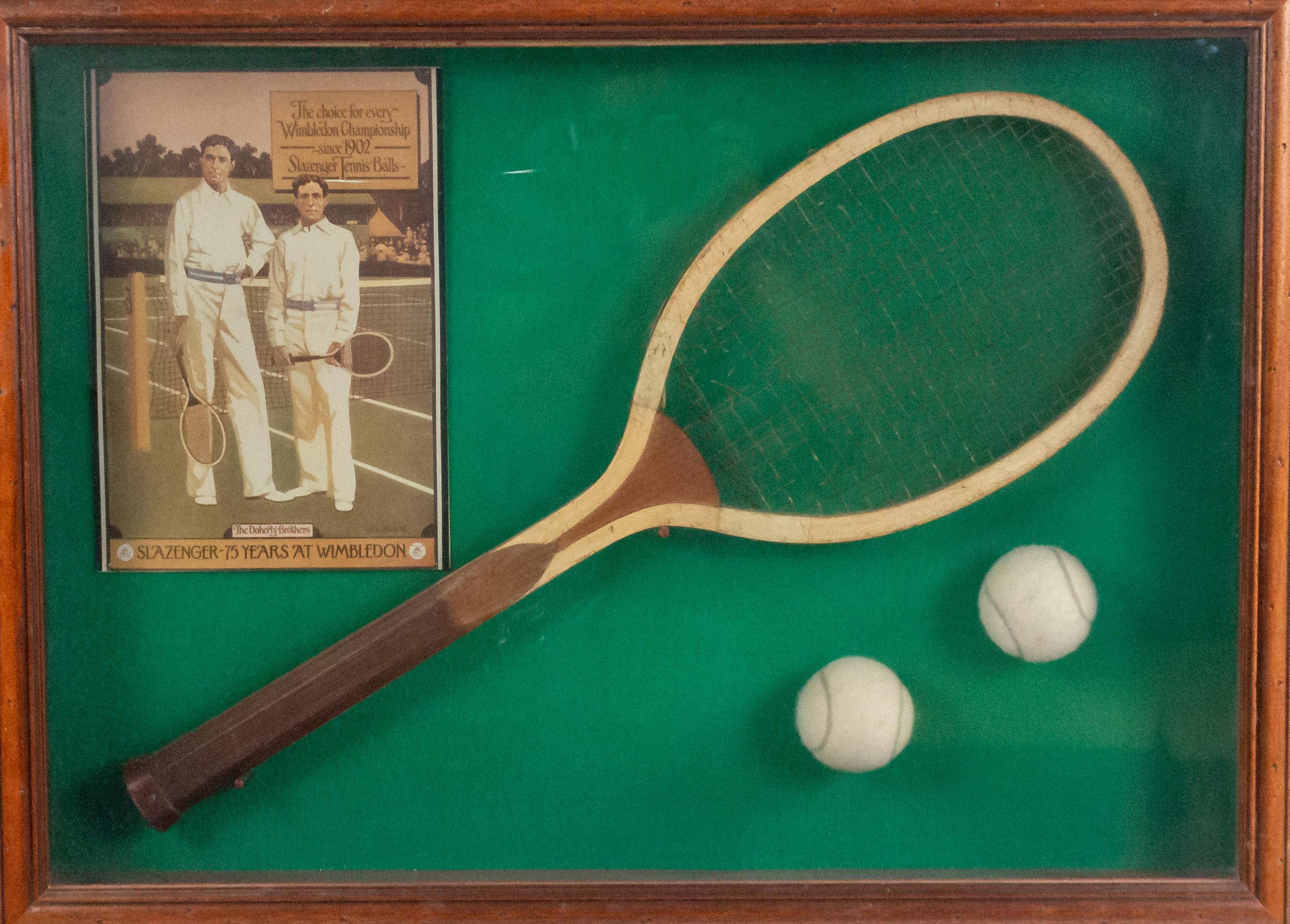 English (20th century) display case wall plaque with tennis racket and balls in mahogany frame.
    