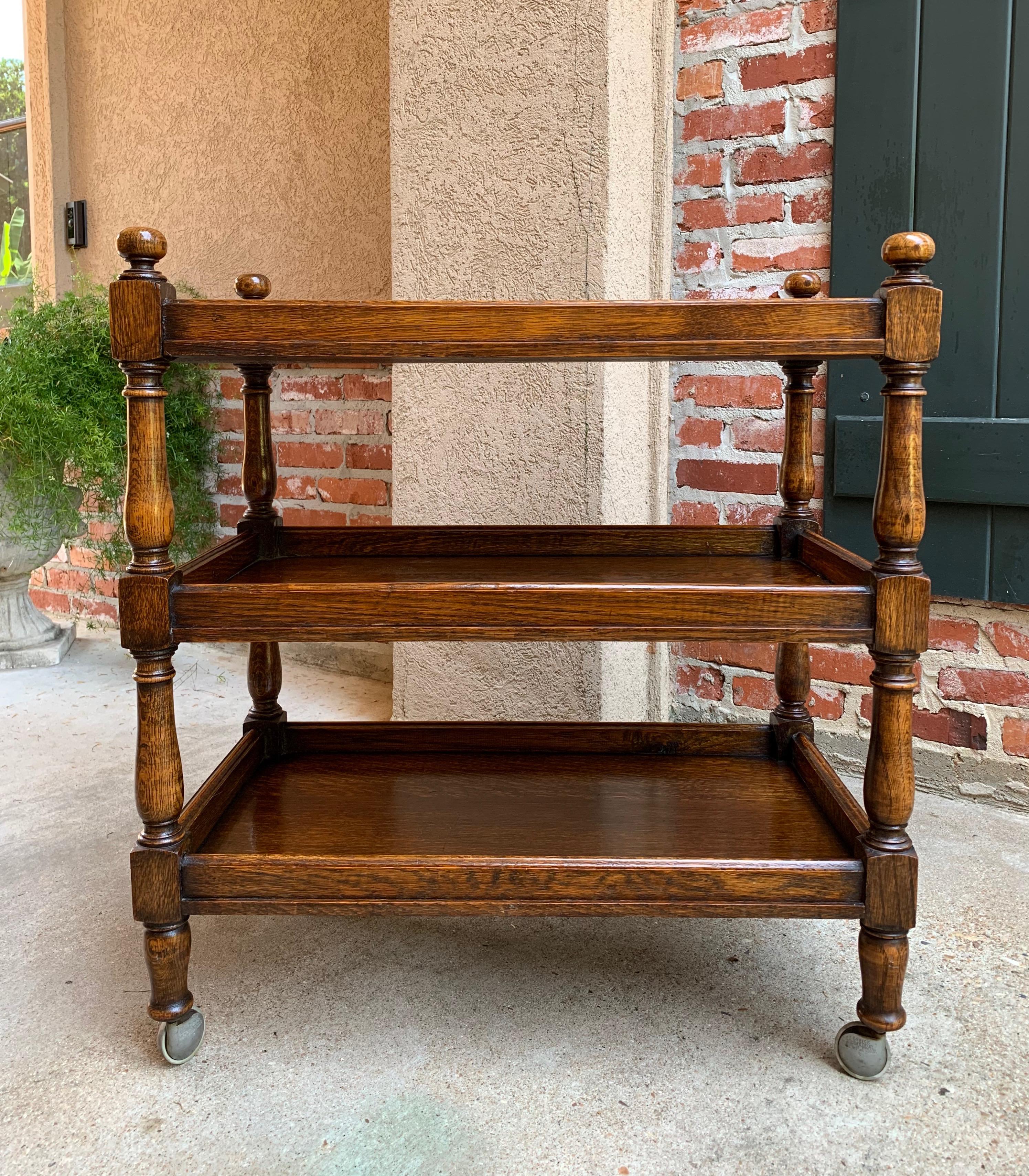 Direct from England, a beautiful antique English oak ‘tea trolley’ or serving cart. These “trolleys” are wonderful for entertaining and great for use as a side table or sofa table!~
~Great three tiersize…these three level trolleys are the hardest