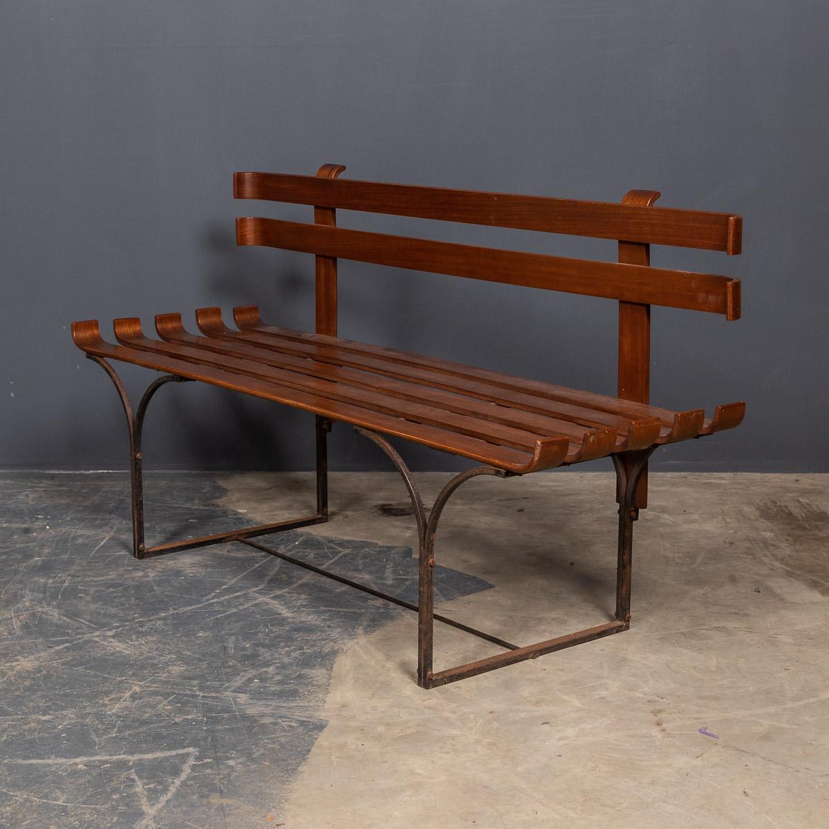 Mid-20th century modern slat bench in walnut with back and iron legs.

Measures: Height: 67cm
Width: 122cm
Depth: 42cm.

  