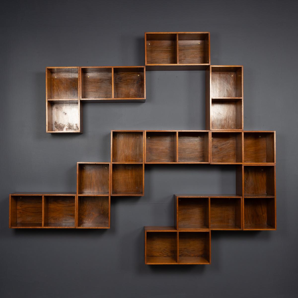 A 20th Century collection of English walnut modular shelving by UNIX, manufactured by Phoenix Gallery in London during the 1960s. Known for their minimalist design and exceptional craftsmanship, these units are both versatile and enduring. Each unit