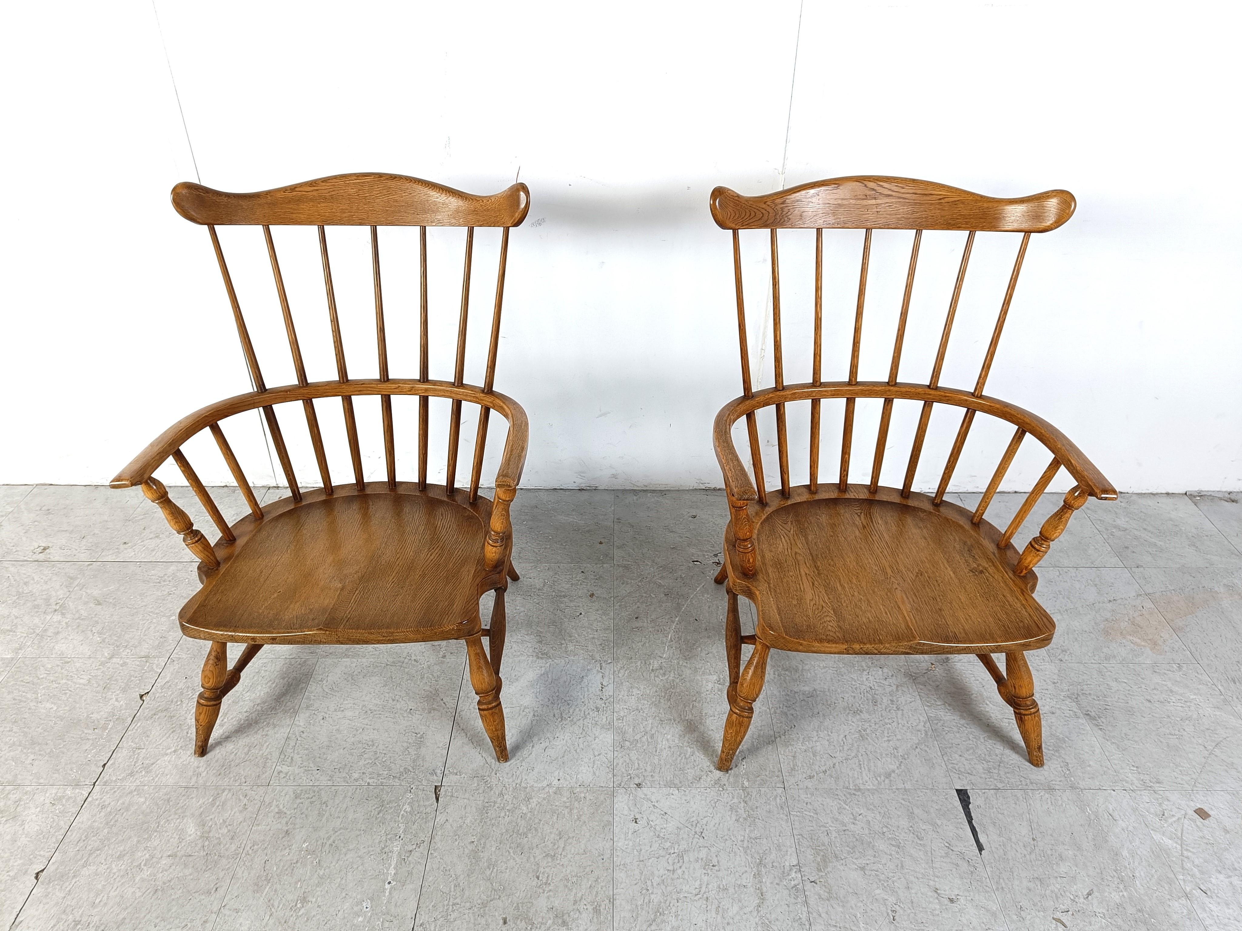 Impressive Windsor armchairs made from ash wood.

Large oversized spindle backrests which has been beautifully shaped.

Elegant pair of chairs with both a functional and decorative value.

1950s - United Kingdom

Good condition

Dimensions: 
Height: