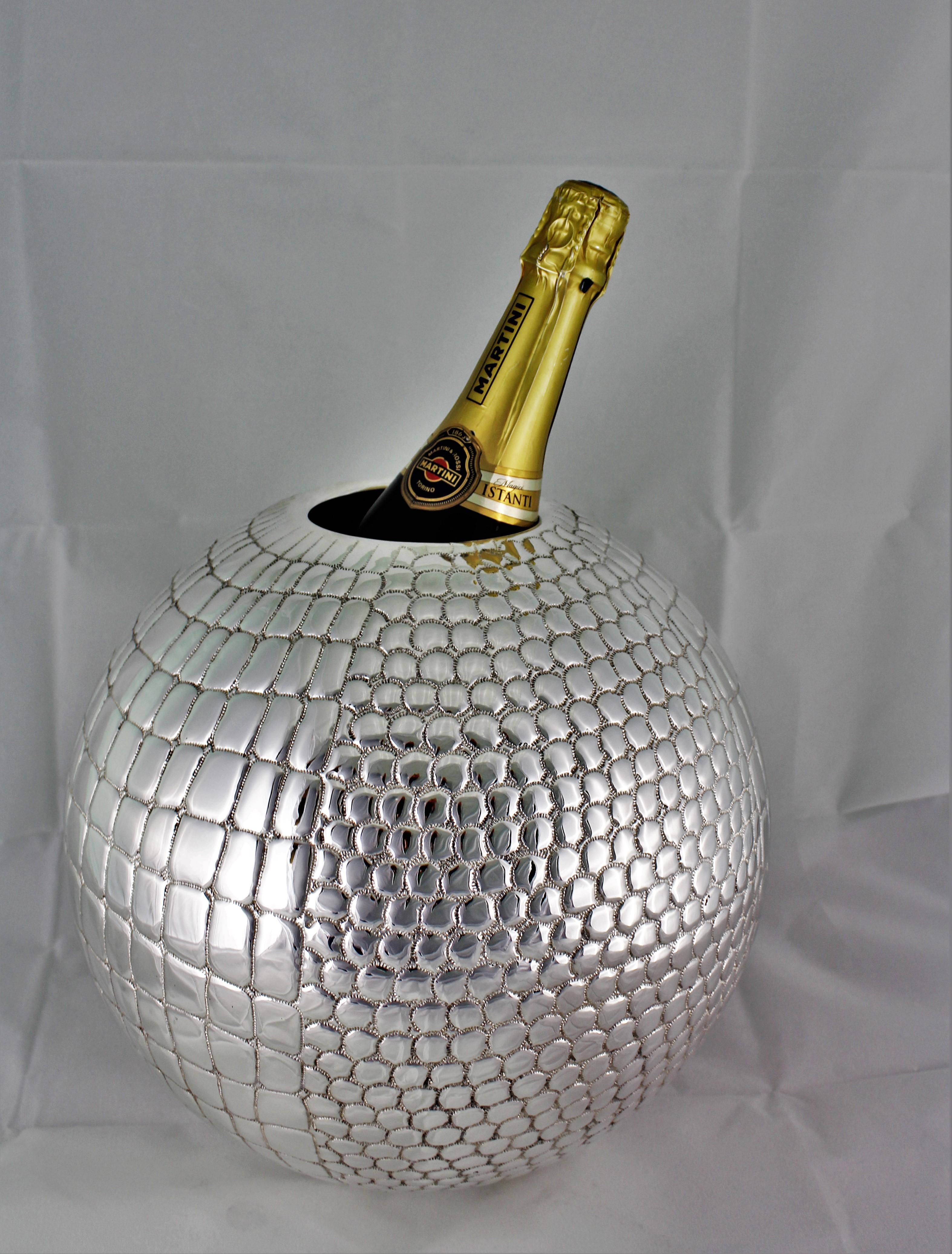 Splendid large engraved silver wine cooler/ flower vase. 

Globe shaped and chiseled crocodile like skin motif.

Can be used as astonishing wine cooler or magnificent flower vase. 

Realized, circa 1950s by the master silversmith Paolo Scavia
