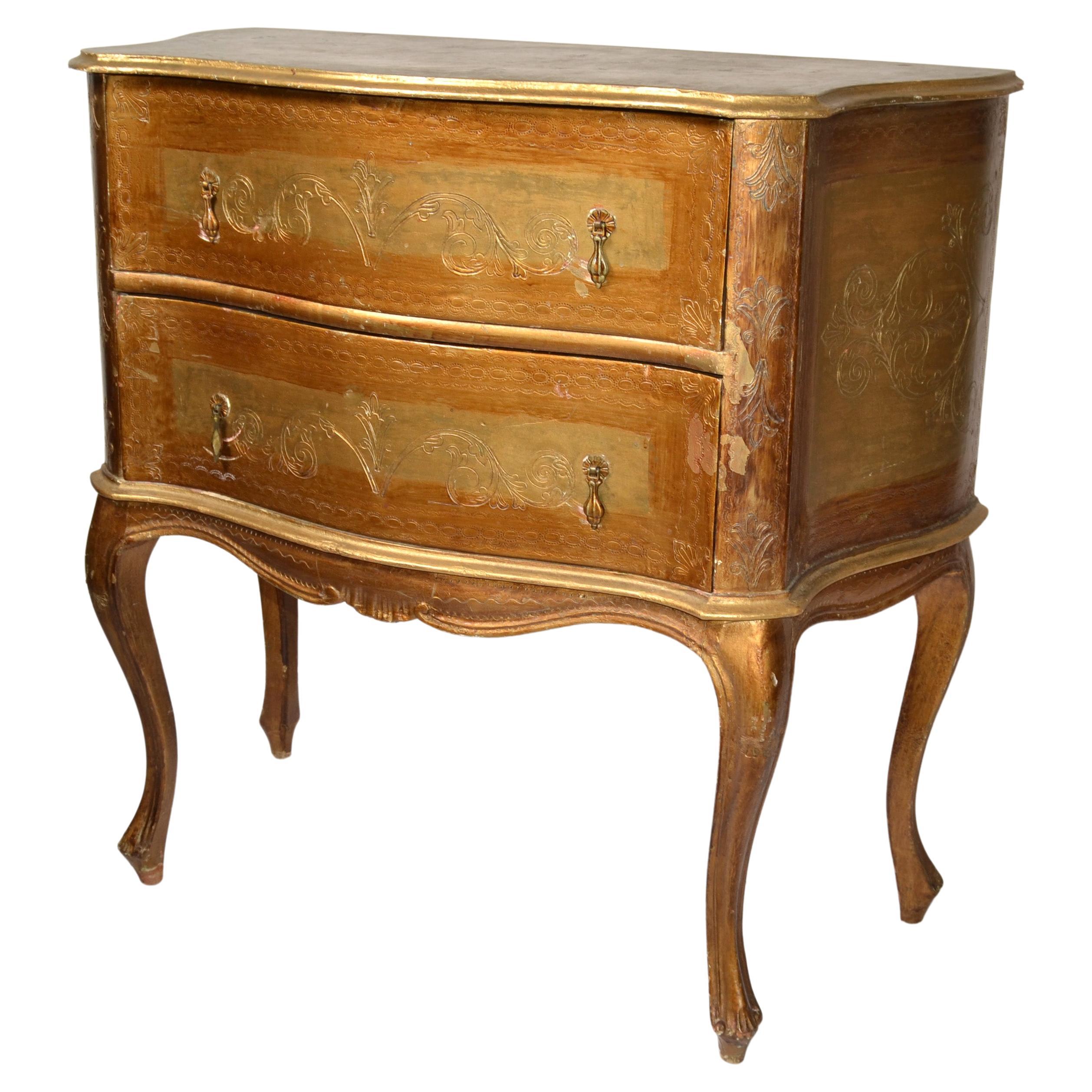This most elegant and charming Italian 20th century Florentine giltwood chest of drawers, commode or cabinet. 
Features hand carved and etched palmette design to the front and both sides, comes with 2 drawers and they have brass pulls. 
Everything