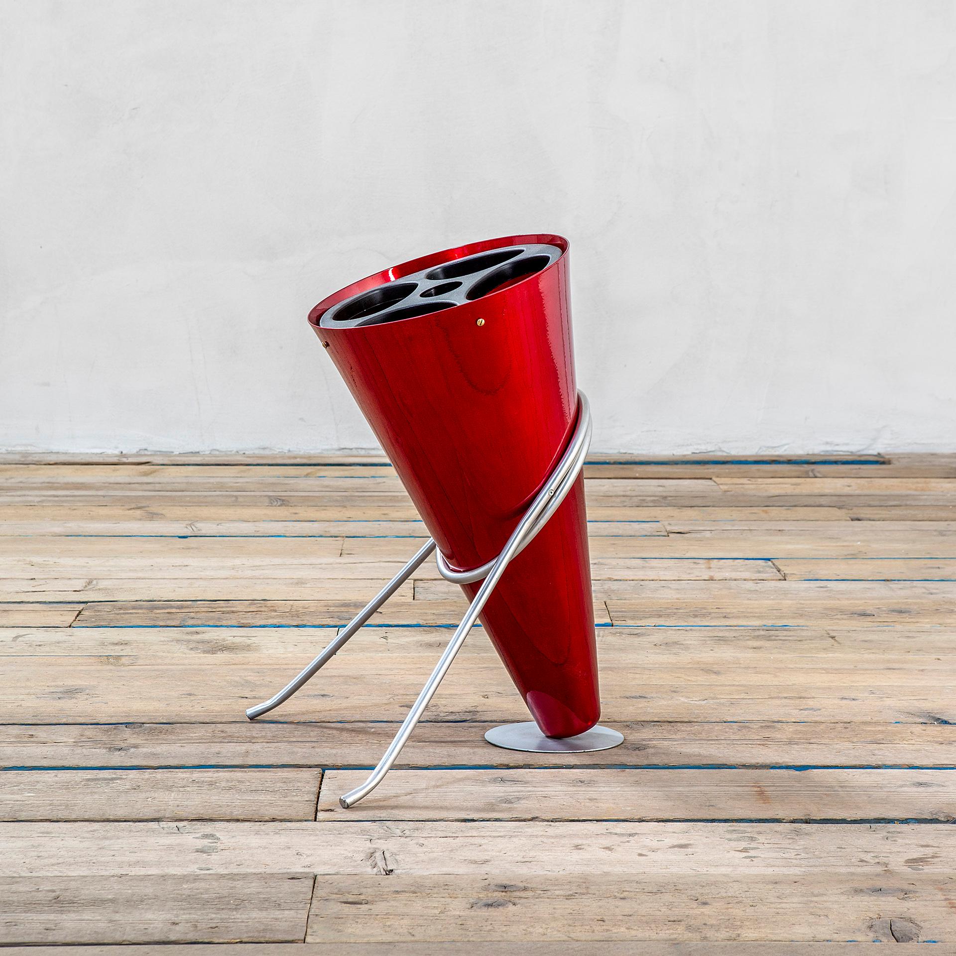 Umbrella standing designed by the master of Italian Design Ettore Sottsass, for the manufacturer Rinnovel in '70s. For Rinnovel, Sottsass designed different pieces, but this item is one of the most representative. The Umbrella Stand is in red