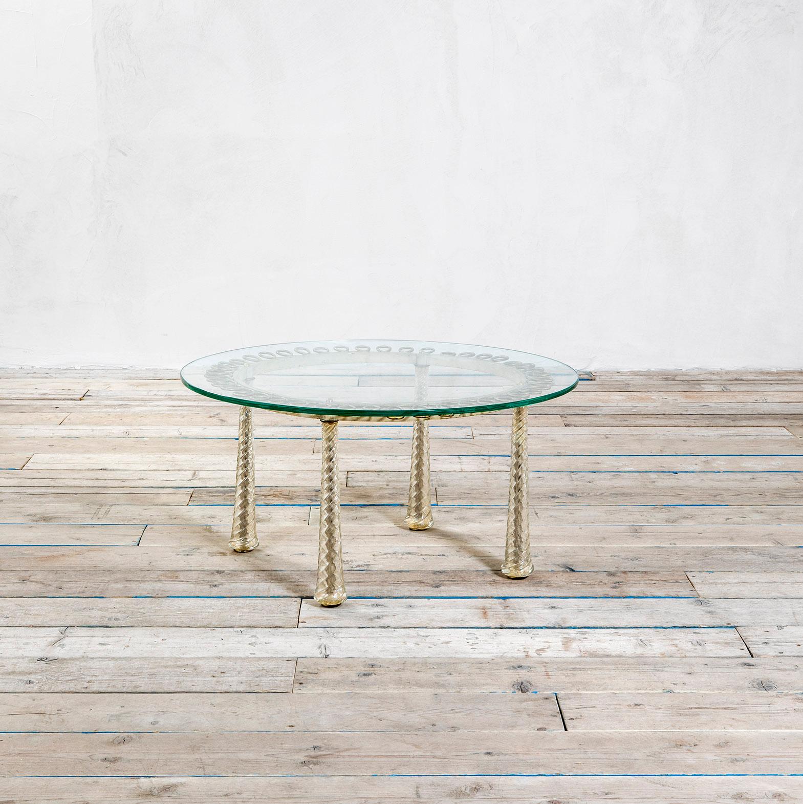 Very rare coffee Table designed by Atelier Quarti, illustrious master of the art of marquetry in Italy and all over the world. The table has a structure in brass, feet are in very special murano Glass in shape of Spiral, the top is in ground glass.