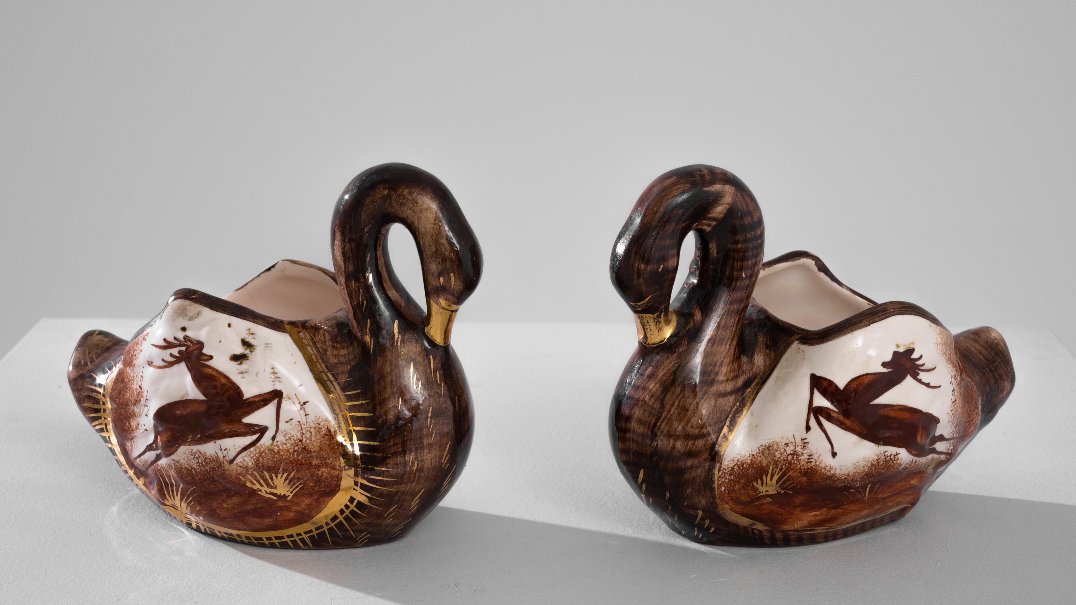 Introducing this exquisite 20th Century European Ceramic Swan – a versatile piece that effortlessly transitions between being a charming planter and an alluring decorative accent. The swan's elegant form is enhanced by rich brown hues and intricate